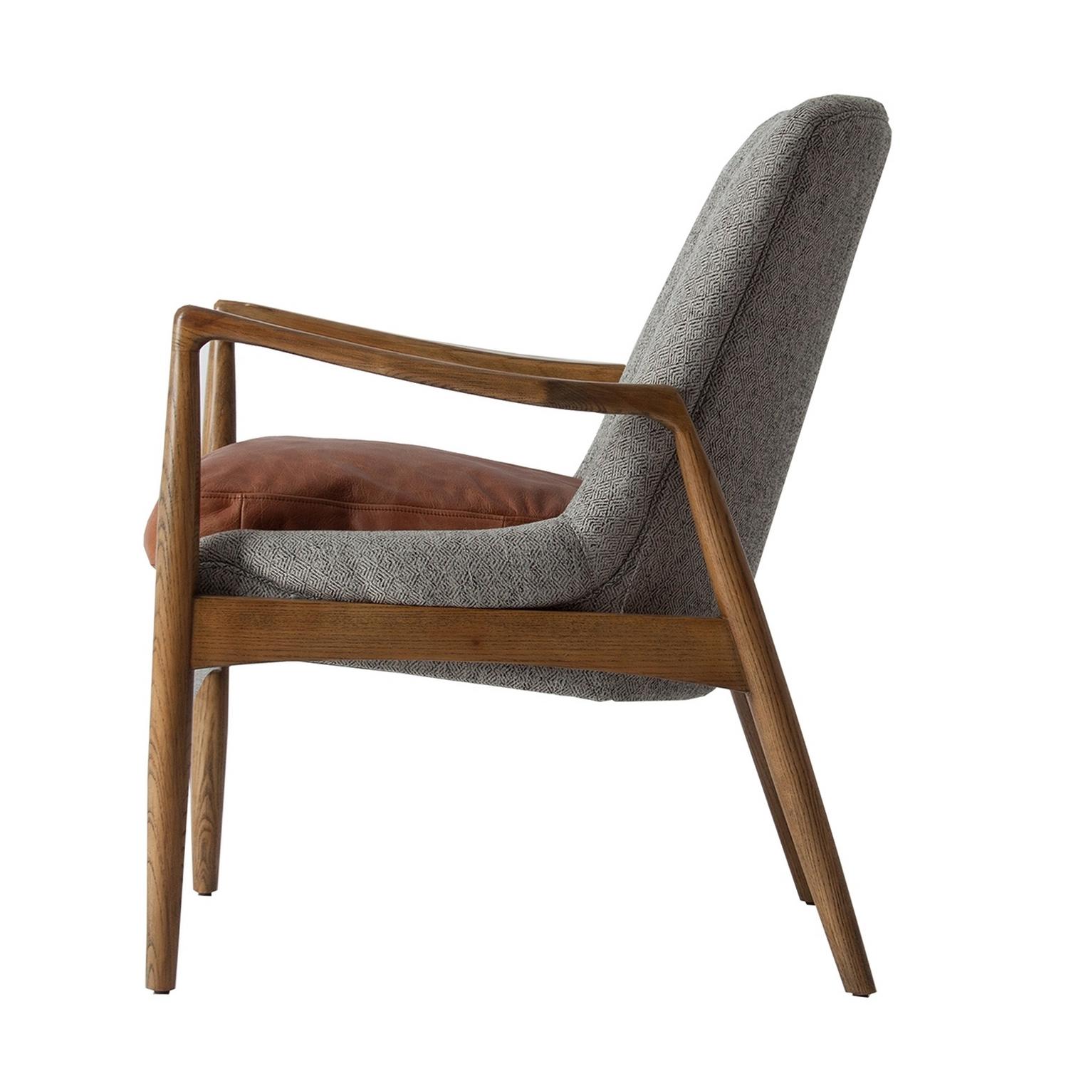 Wooden structure and graphic fabric adorned with a cognac pillows chair in a midcentury style and Scandinavian design.