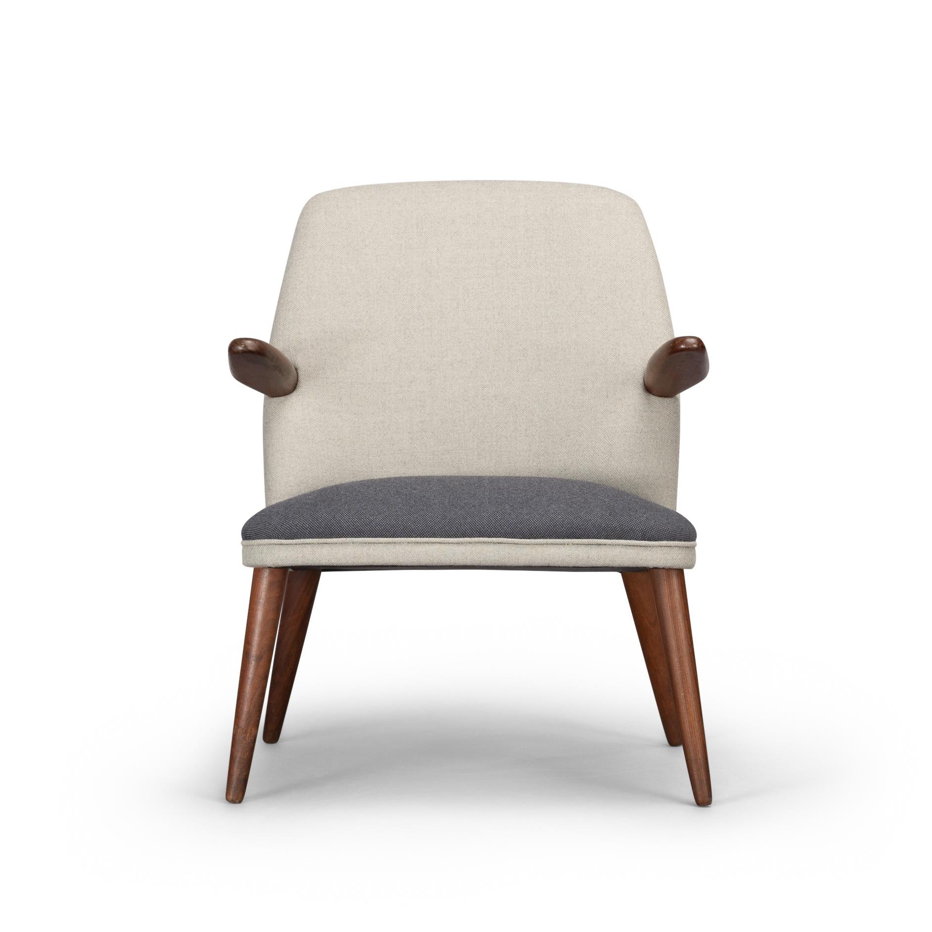Fab looking early 60s two armed cocktail chair reupholstered in twin colour pure wool fabric. Legs and arms in solid teak and very durable beech internal frame make this a high quality made chair ideal for placement in a living room setting. The