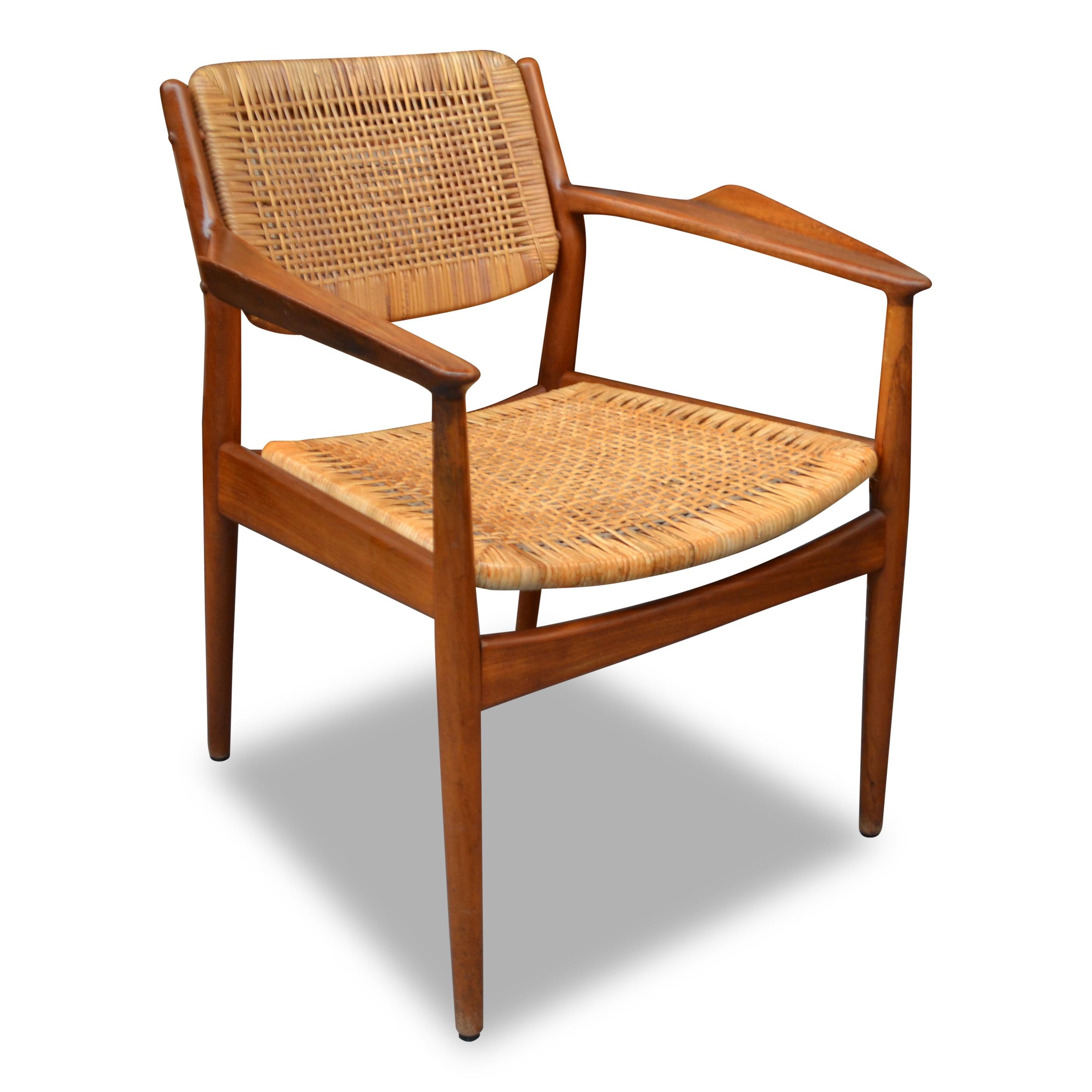 Rare vintage Danish design teak/rattan chair designed by Arne Vodder for Sibast Furniture in the 1950s. Arne Vodder was trained by Finn Juhl and eventually became his business partner. He studied under Juhl at the Royal Danish Academy of Fine Arts