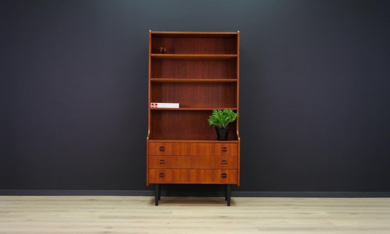 Fantastic library, 1960-1970 bookshelf, minimalistic form, Scandinavian design. The whole veneered with teak. Spacious shelves and two drawers. Preserved in good condition (small dings and scratches) directly for use.

Dimensions: height 171 cm,