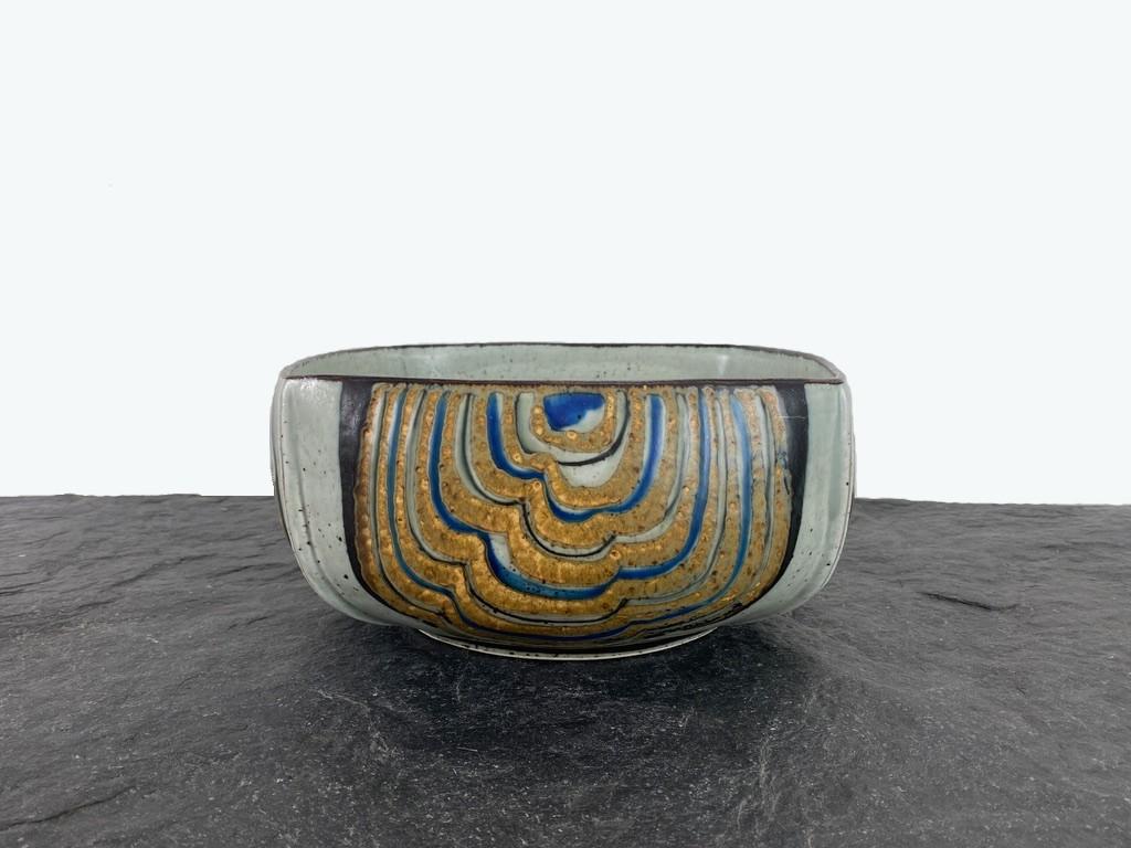 A stunning Royal Copenhagen stoneware bowl, designed by Ivan Weiss, made in Denmark. A Danish Design masterpiece. The bowl is marked 11/22564, and has the Royal Copenhagen hallmark in use from 1975 to 1979, as well as Ivan Weiss' monogram. 

The