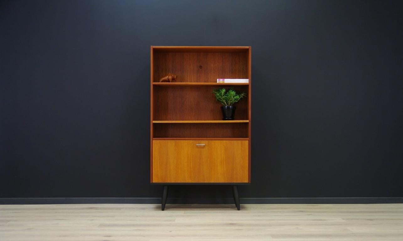 Cabinet from 1960s-1970s, Danish design. Surface veneered with teak. It has a capacious bar with a shelf behind the doors. Preserved in good condition (scratches and dings, filled veneer loss, discoloration on the side) - directly for