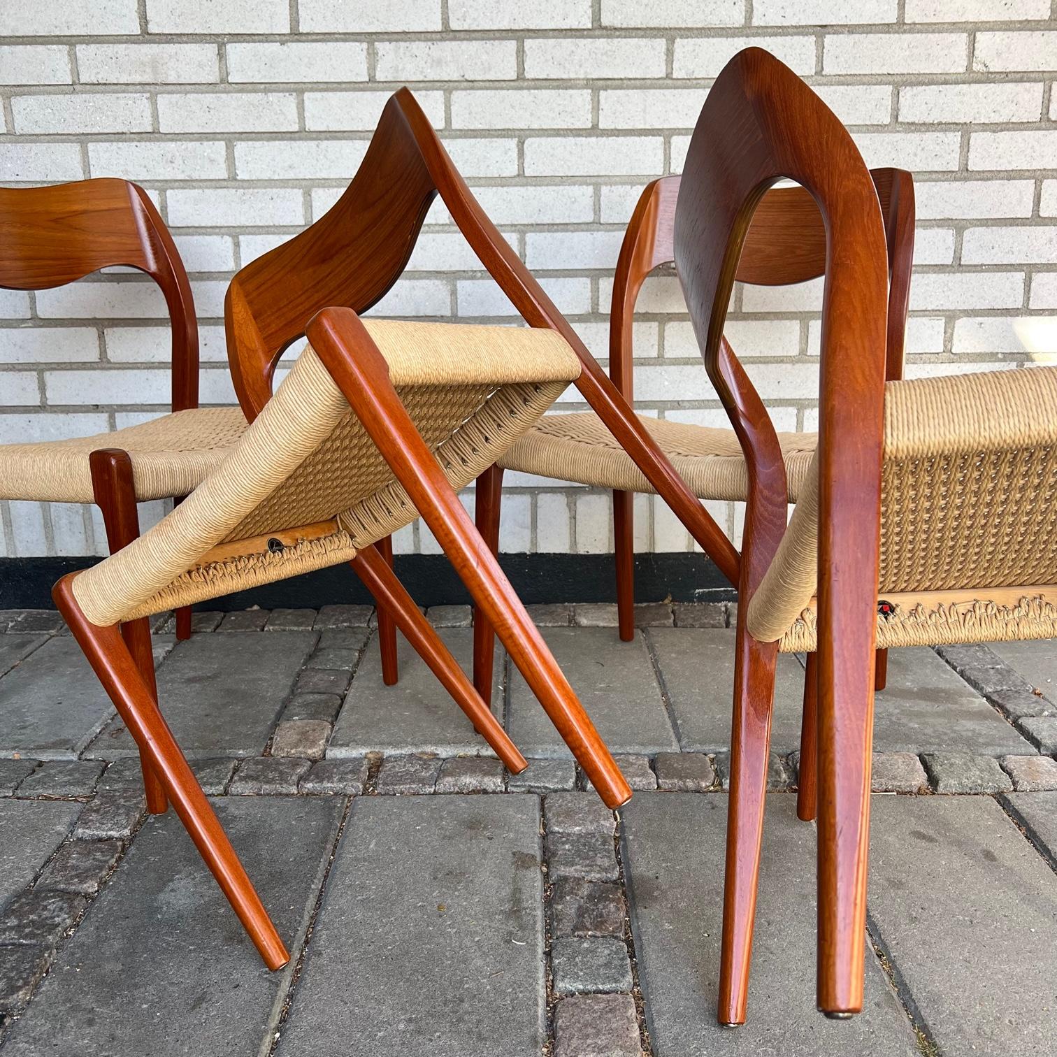 Four dining chairs by Niels O. Moller for J.L. Møllers Møbelfabrik. The Chairs is called modell 71 and is a comfortable chair made in teak and papercord. 