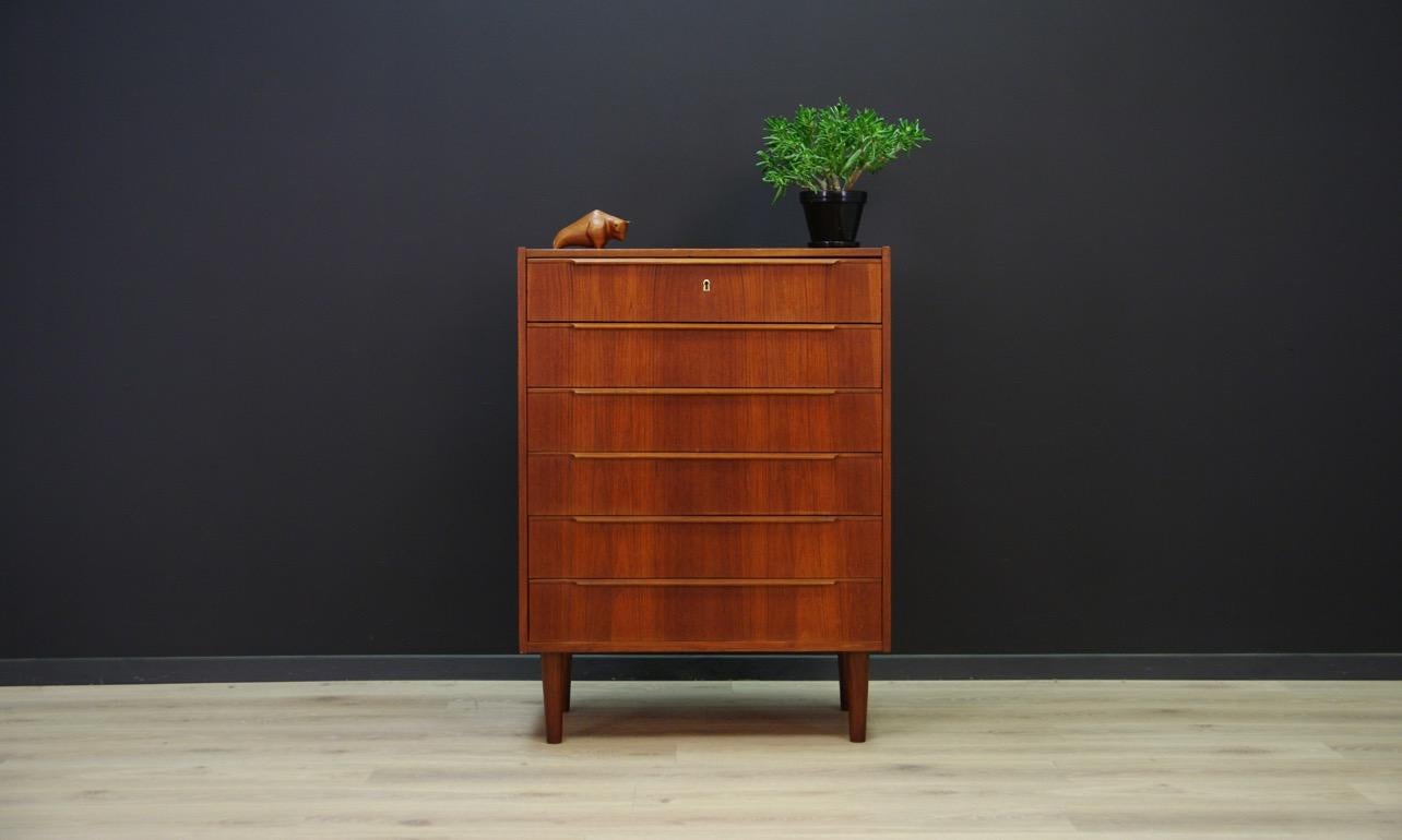 Original chest od drawers from the 1960s-1970s, Minimalist form - Danish design. Six capacious drawers. The form is veneered with teak. Handles made of solid teak. No key in the set. Preserved in good condition (small bruises and scratches) -
