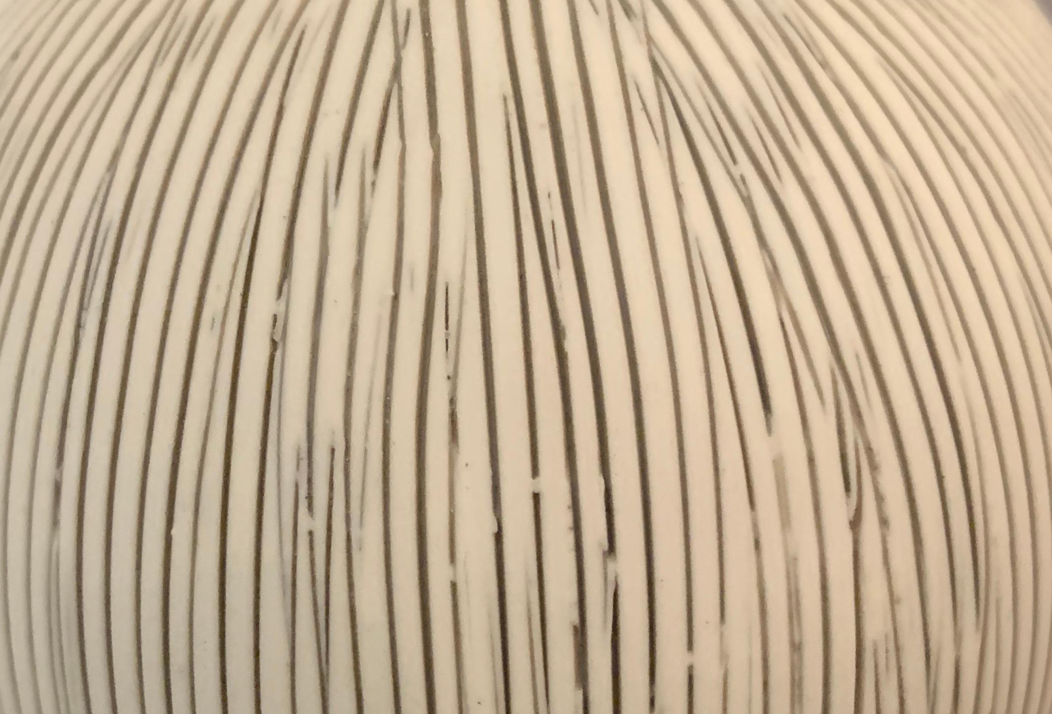Contemporary Danish design white porcelain vase with fine black stripes
Small in size and in opening.