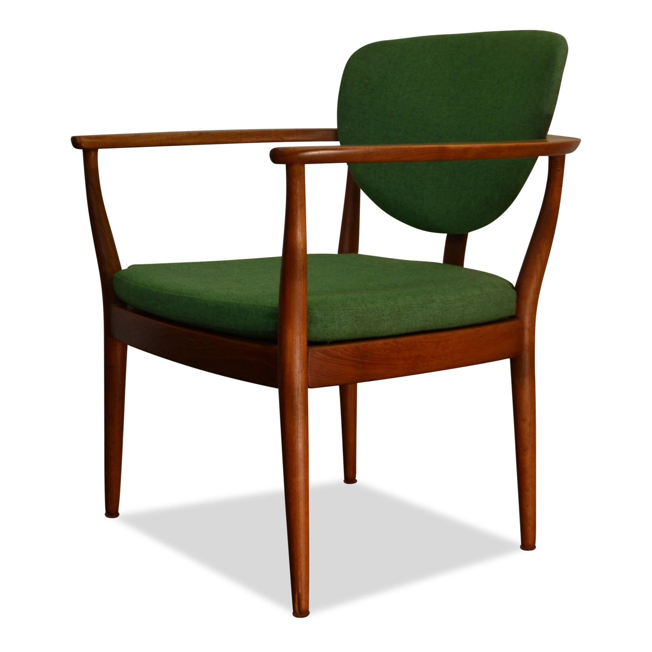 Super stylish vintage lounge chair designed by an unknown Danish designer. Made out of beautiful teakwood, upholstered in beautiful green woven fabric, loose seat cushions and featuring gorgeous curved backrest. This chair just breaths 1960s Danish