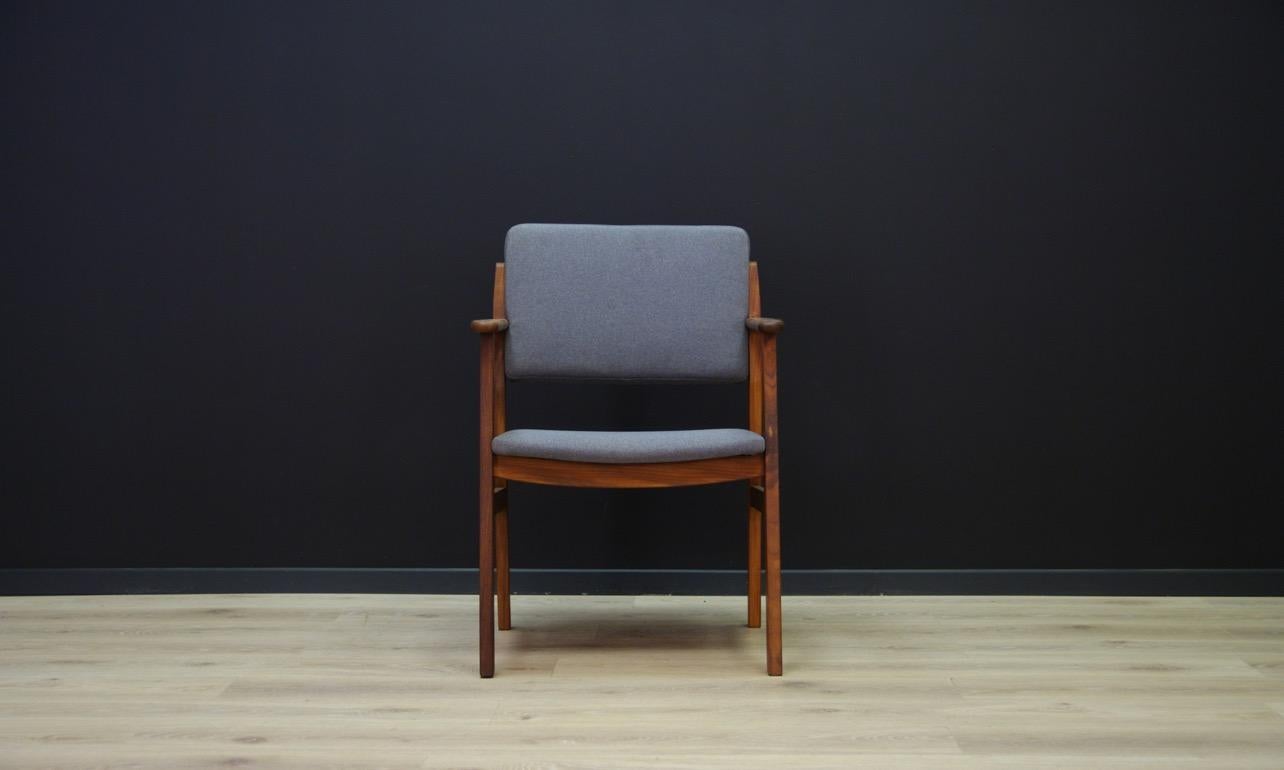 Retro armchair from the 1960s these are a beautiful, Minimalist form with amazing armrests. Teak construction covered with a new fabric (color-gray). Preserved in good condition (visible minor scratches and upholstery on the structure) directly for