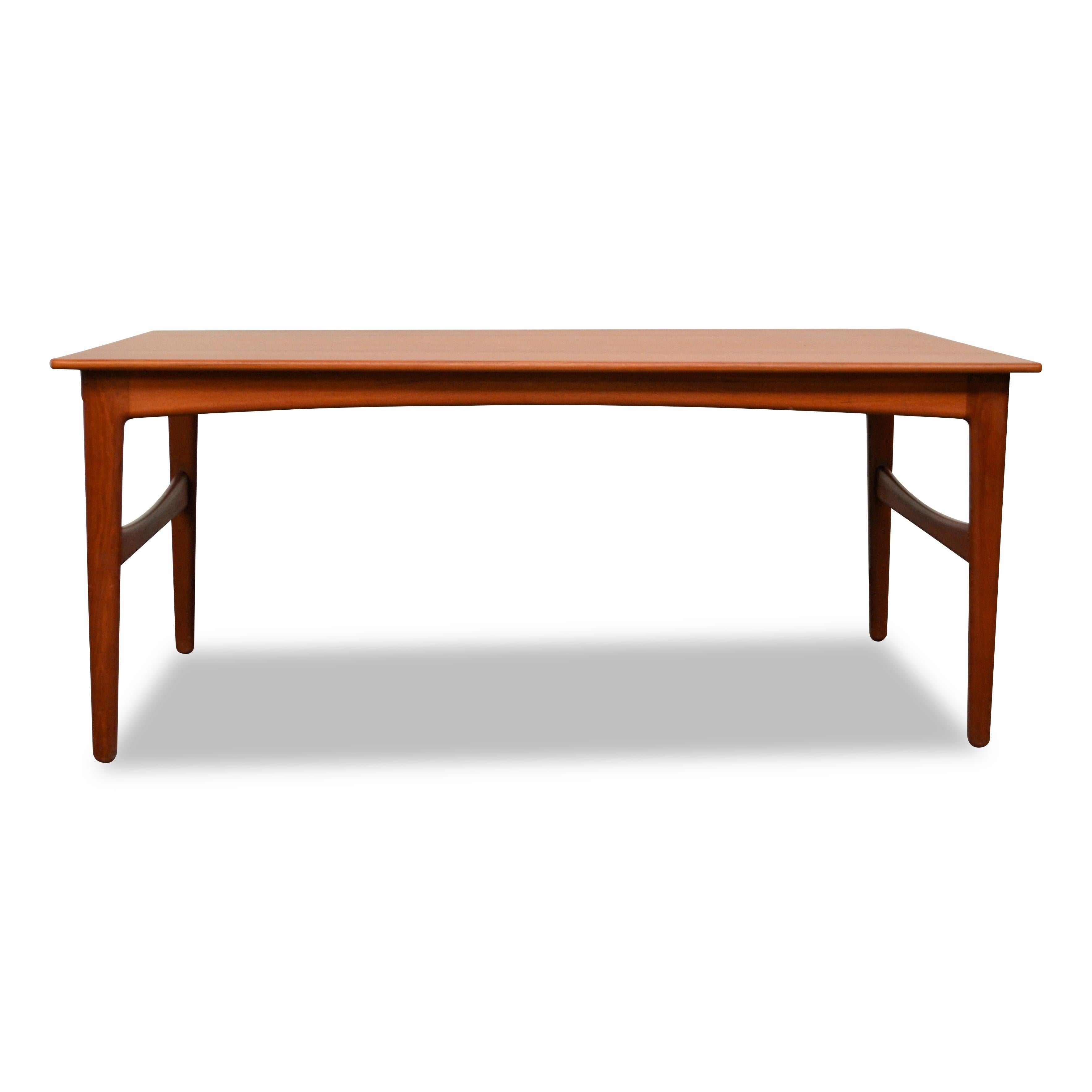 Rare high-end teak dining table designed by Knud Andersen for Danish manufacturer J.C.A. Jensen. This unique table features a clean, simple yet sophisticated design and beautiful teak wood. You’ll easily host up to 8 (!) dinner guests around the