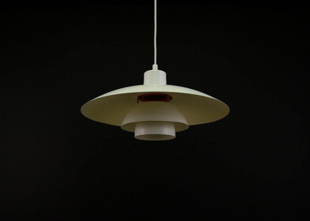 The original lamp from the Louis Poulsen label from the 1960s-1970s, PH 4/3 model designed by Poul Henningsen. White color. Preserved in good condition (minor scratches) - directly for use.

Dimensions: Diameter 40 cm.