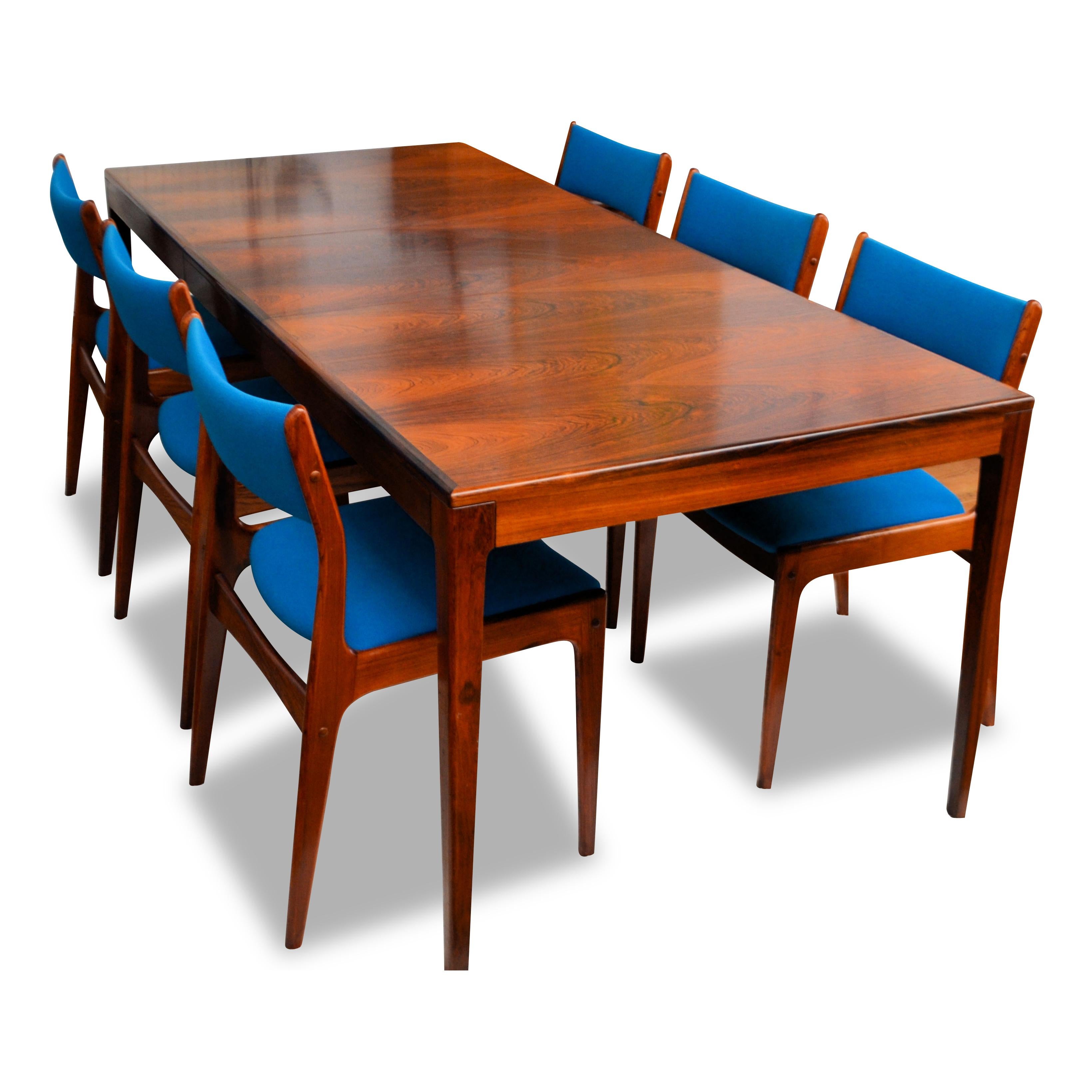Vintage Danish design rosewood dining set, consisting of a rosewood extendable designed by C.J. Rosengaarden, combined with a set of six rosewood dining room chairs, designed by Johannes Andersen. High-end Danish modern design featuring a clean,