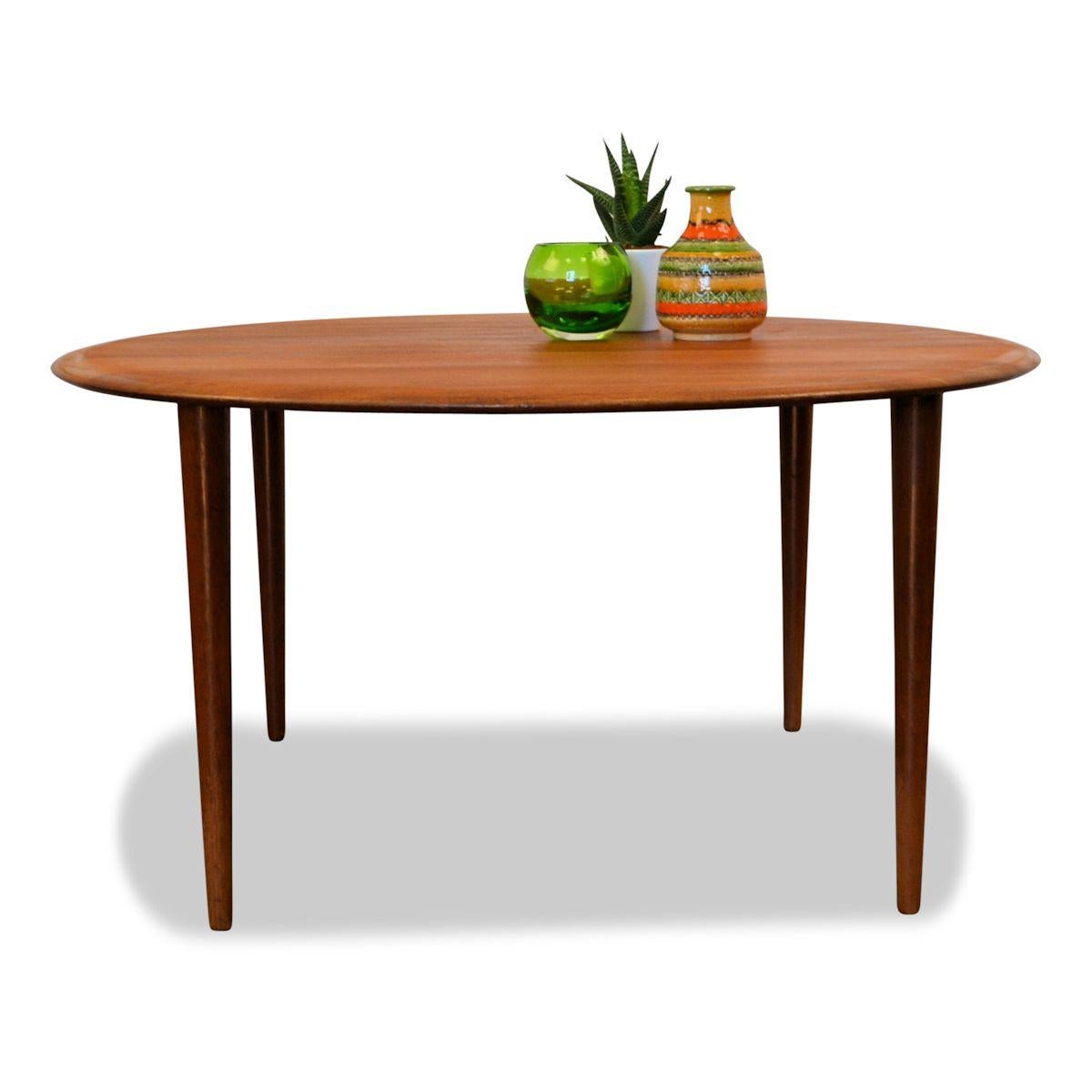 Danish Modern teak coffee table designed by top designer duo Peter Hvidt & Orla Mølgaard-Nielsen for France & Son. Works of the duo are represented at the MOMA in New York, the National Gallery in Melbourne and the Danish Museum of Art & Design in