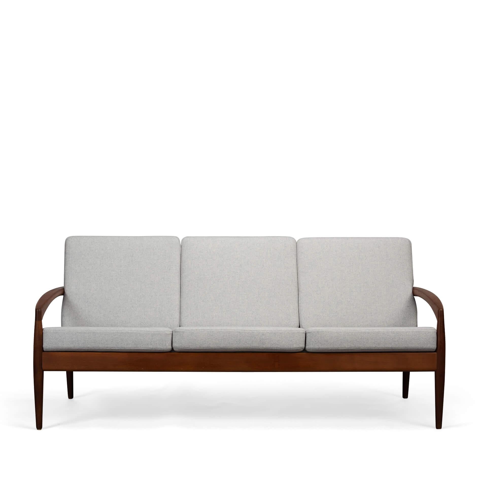 Model 121 sofa : Paper Knife sofa
We are so pleased to present this drop-dead gorgeous and rare ‘Paperknife’ couch designed in the 1950s by Kai Kristiansen for Magnus Olesen, Denmark. This is a 3-seat model in solid teak with brass fittings. Named