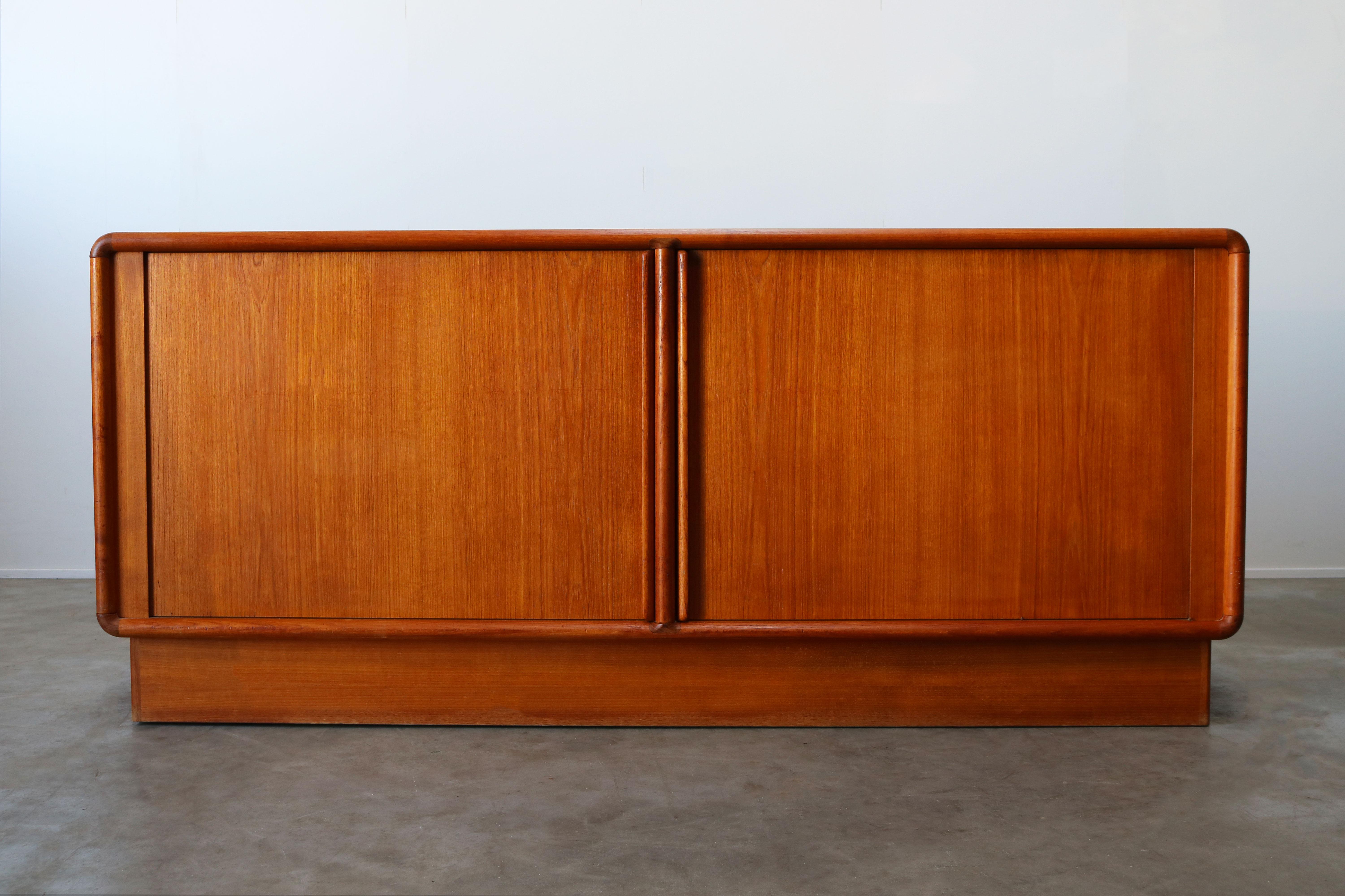 Danish design sideboard / credenza with tambour doors in teak by the Kibaek Mobelfabrik produced in Denmark in the 1950s. The Kibaek Mobelfabrik is known for its high quality Danish furniture and this piece perfectly reflects that. The sideboard has
