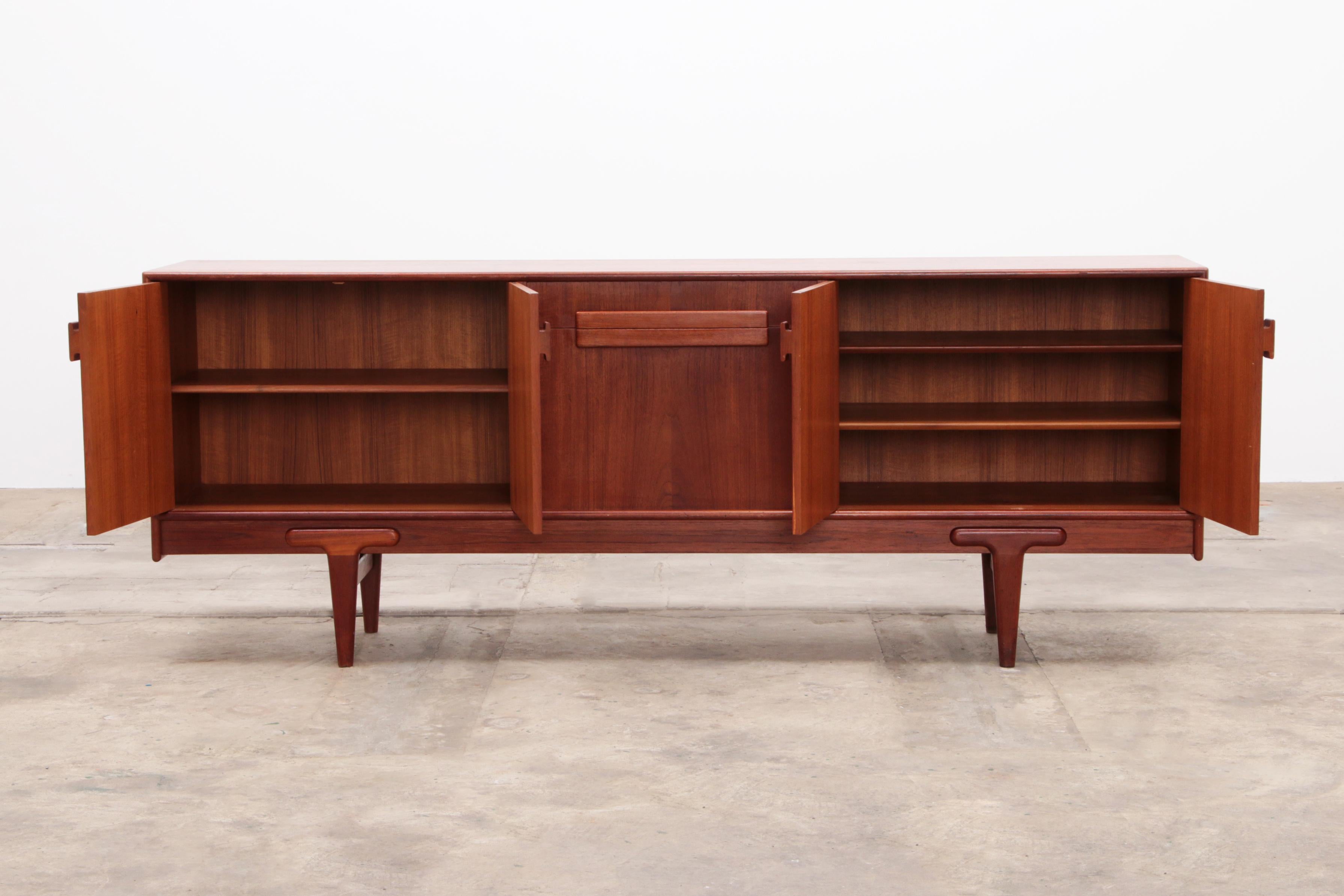 
Product description

Discover the timeless elegance of this authentic Danish design sideboard, a masterpiece by A.Johansson for Gern Mobelfabrik from the 1960s. This impressive piece of furniture, made from high-quality teak wood, exudes the
