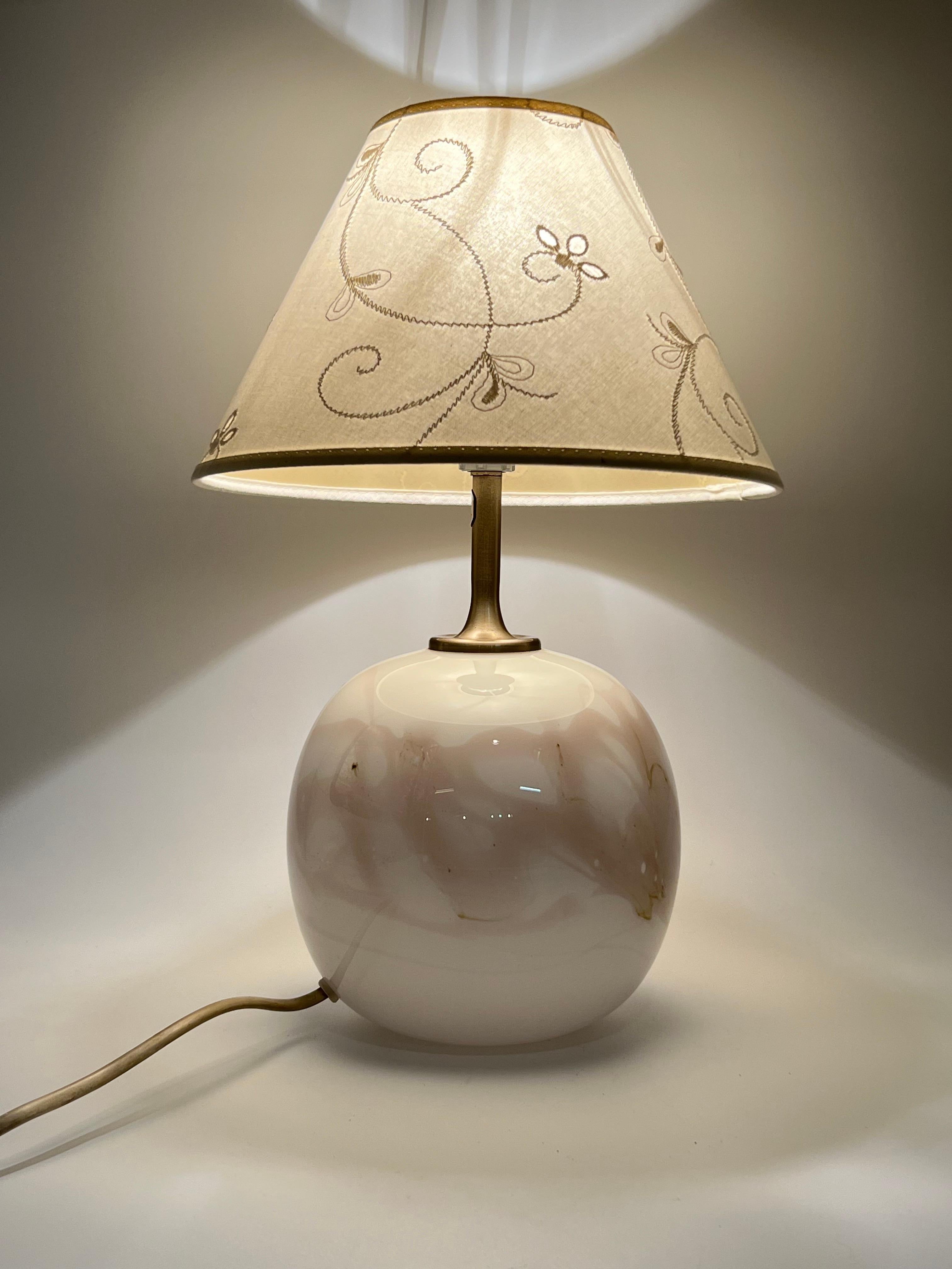 Vintage Murano-Style Scandinavian Mid-Century Modern Table Lamp, circa 1960s.

Danish craftsmanship. Art glass lamp from Holmegaard, Denmark, featuring a floral-patterned white/ivory-colored lampshade. Elegant design with stunning