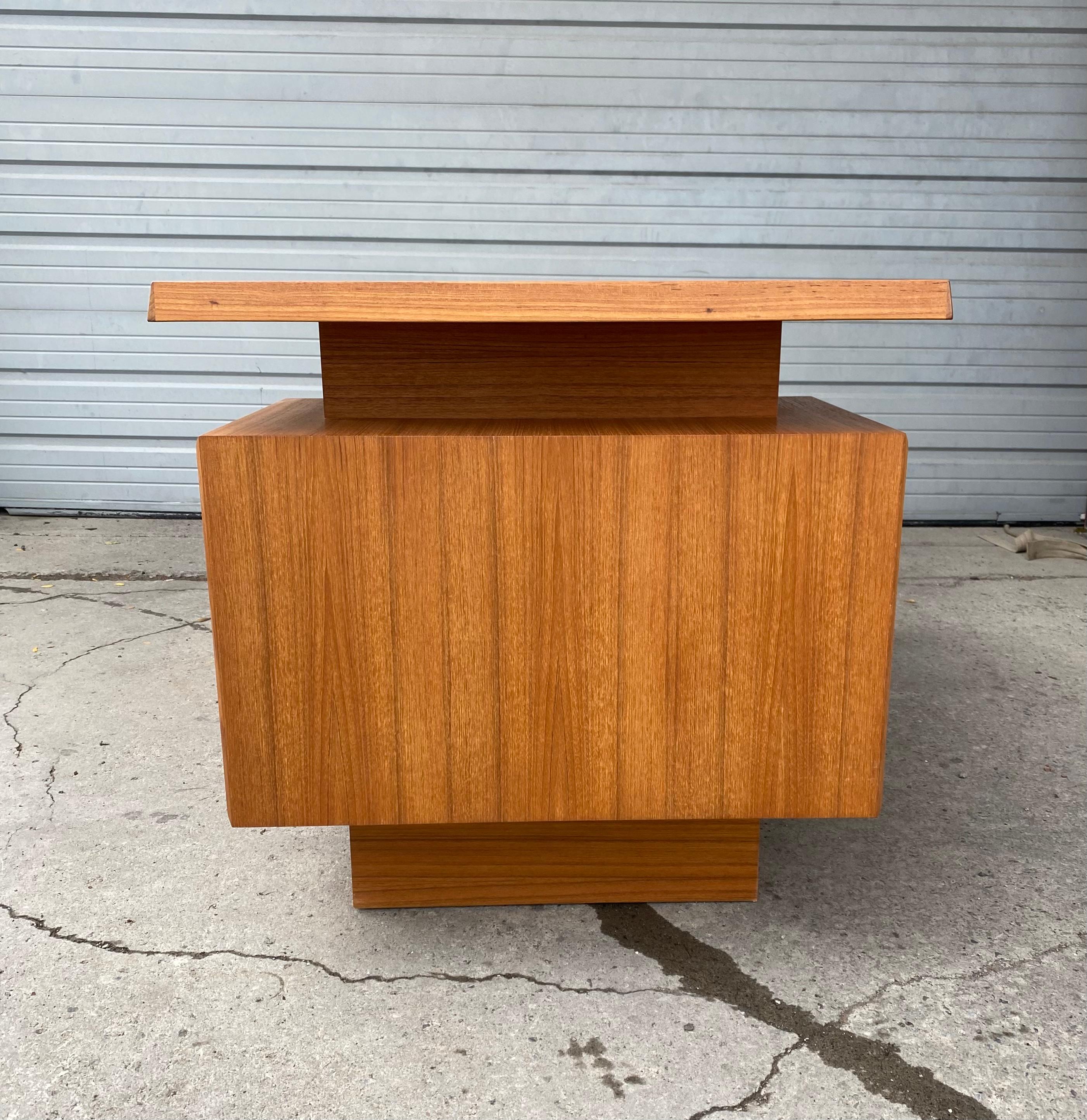 Wonderful Danish design Teak desk made by Mobican,, Beautiful Architectural design,, Locking file drawer.. Finished on all sides so can be used in center of a room.. Excellent original finish and patina.. Slight ghost mark from desk blotter,, hardly