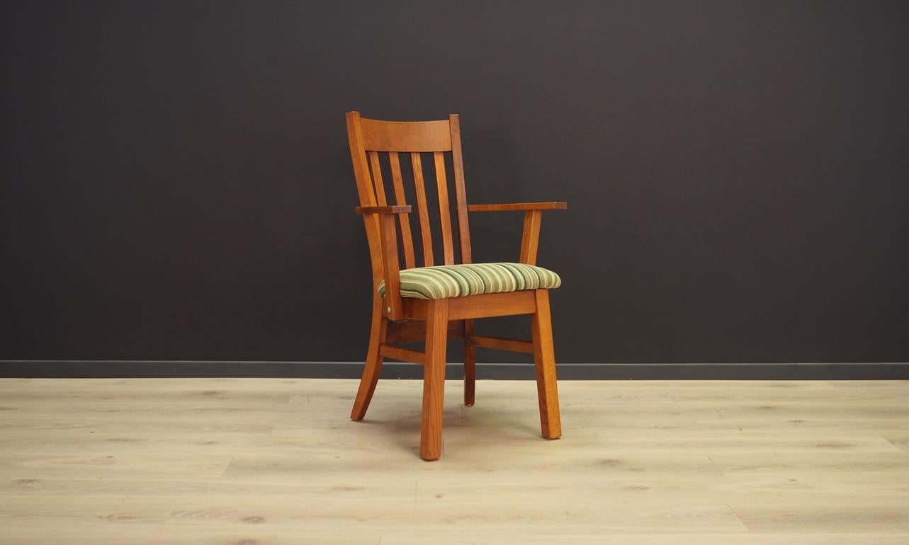 Minimalistic armchair of the 1960s-1970s, Scandinavian design. Original armchair upholstered with the fabric in green stripes. Construction finished with teak veneer. Armchair in good condition (minor scratches) - directly for use. 

Dimensions: