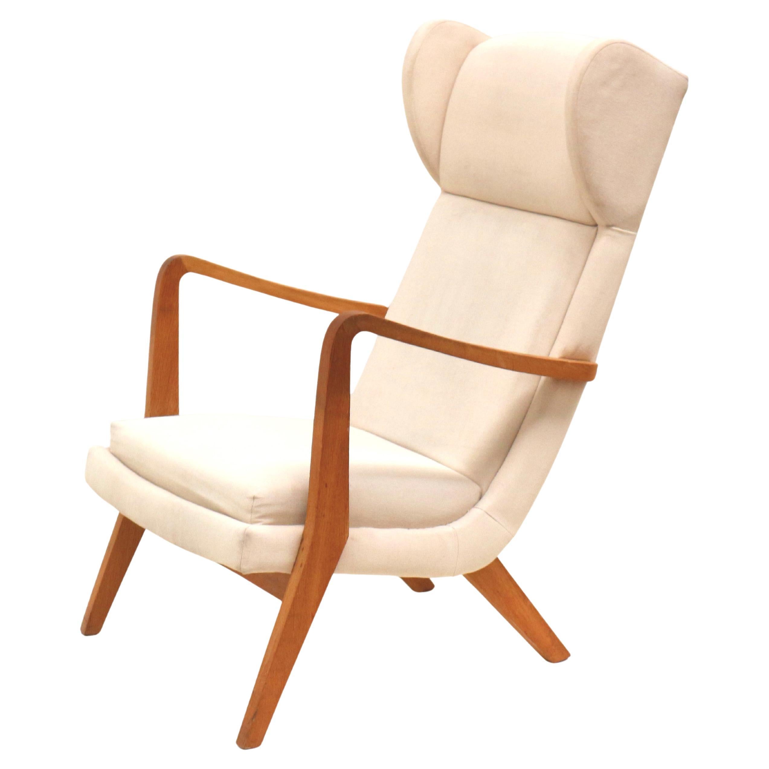 Danish design vintage armchair with cream upholstery from the 70s