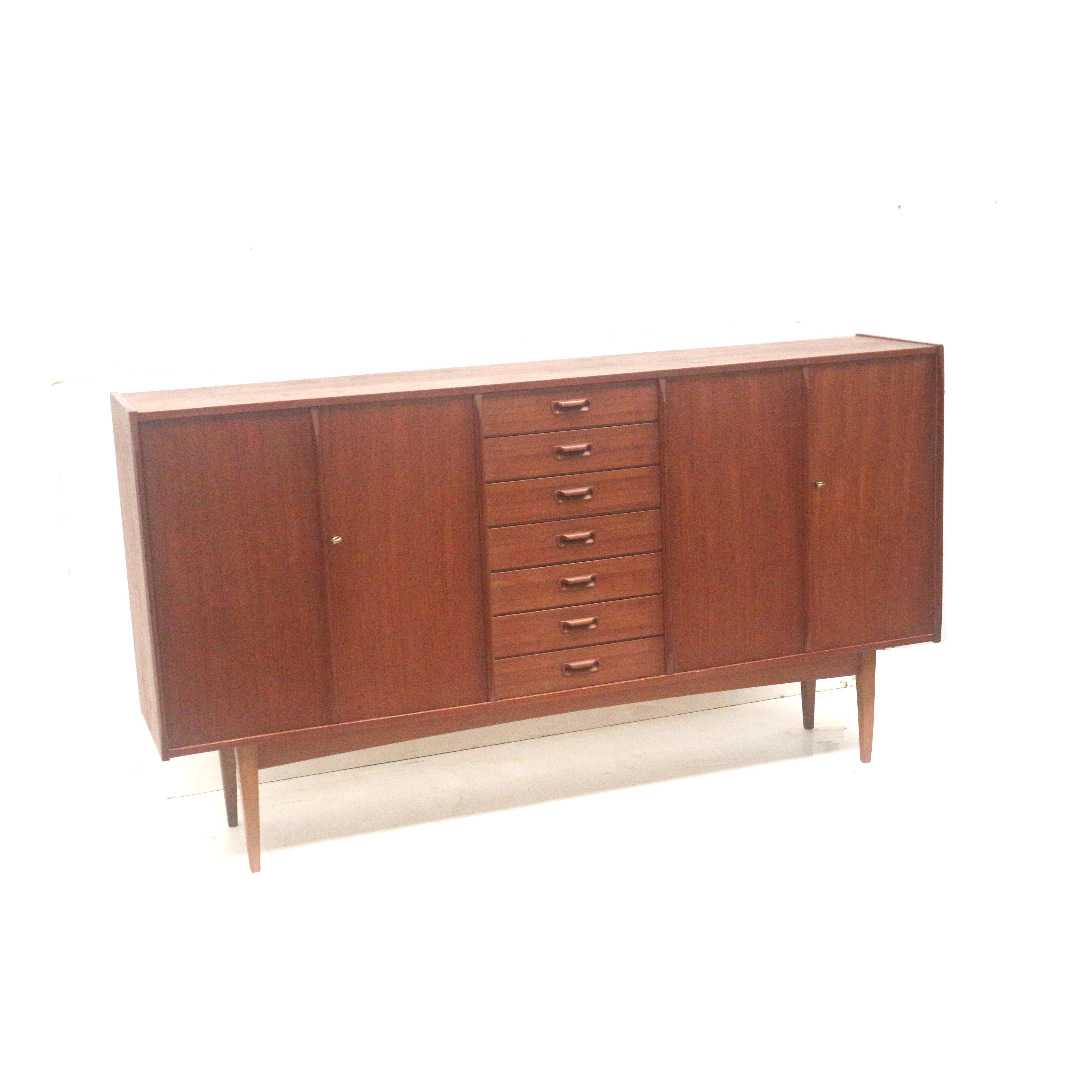 Danish design vintage sideboard made of teak from the 1960s.

Dimensions:
Width: 220.3 cm
Depth: 43.7 cm
Height: 120 cm

The sideboard has small traces of use consistent with its age.
