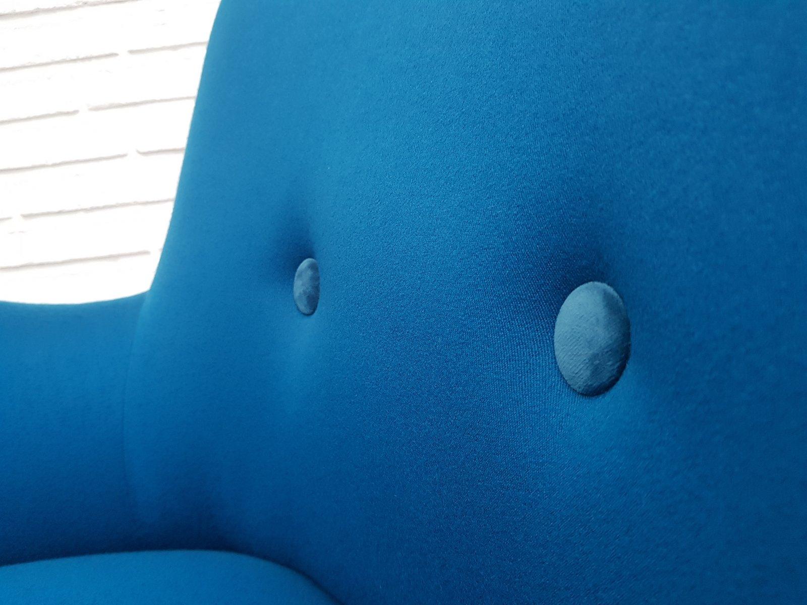 Danish designed armchair. New reupholstered in quality turquoise blue wool fabric. Velour buttons. Renovated, reupholstered by professional furniture upholsterer at Retro Møbler Galleri. Made by Danish furniture manufacturer in about 1970. The seat