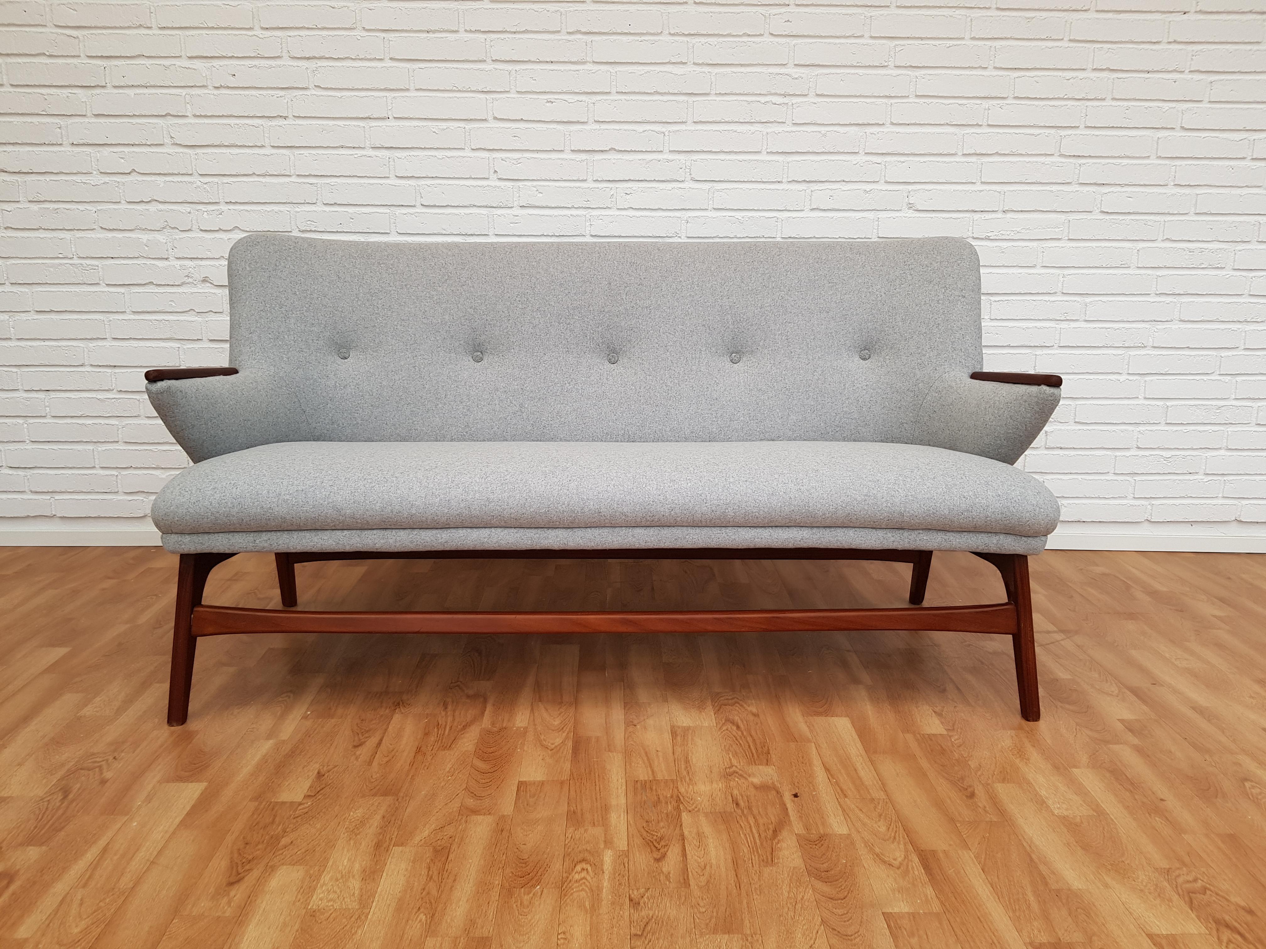 Danish designed sofa set. High-backed armchair, low armchair, sofa. Teak wood. Produced by Danish furniture manufacturer in circa 1960. New reupholstered in the quality dark grey wool fabric and grey wool fabric. Restored by furniture craftsman at