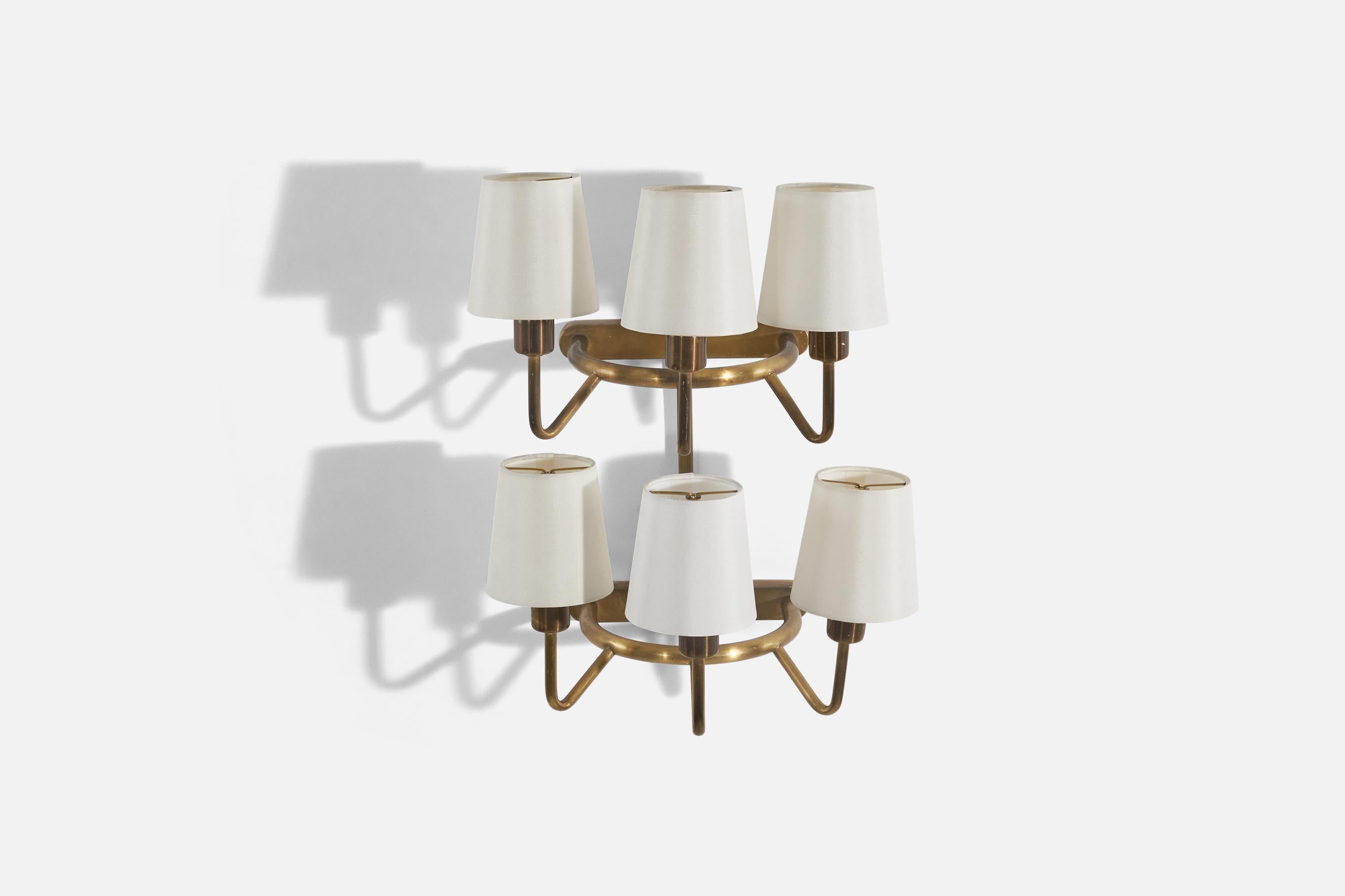 A pair of 6-light brass and fabric sconces designed and produced in Denmark, c. 1940s. 

Sold with Lampshades. 
Stated dimensions refer to the Sconces with the Shades.
Dimensions of back plates (inches) : 1.27 x 8.37 x 0.81 (Height x Width x Depth).