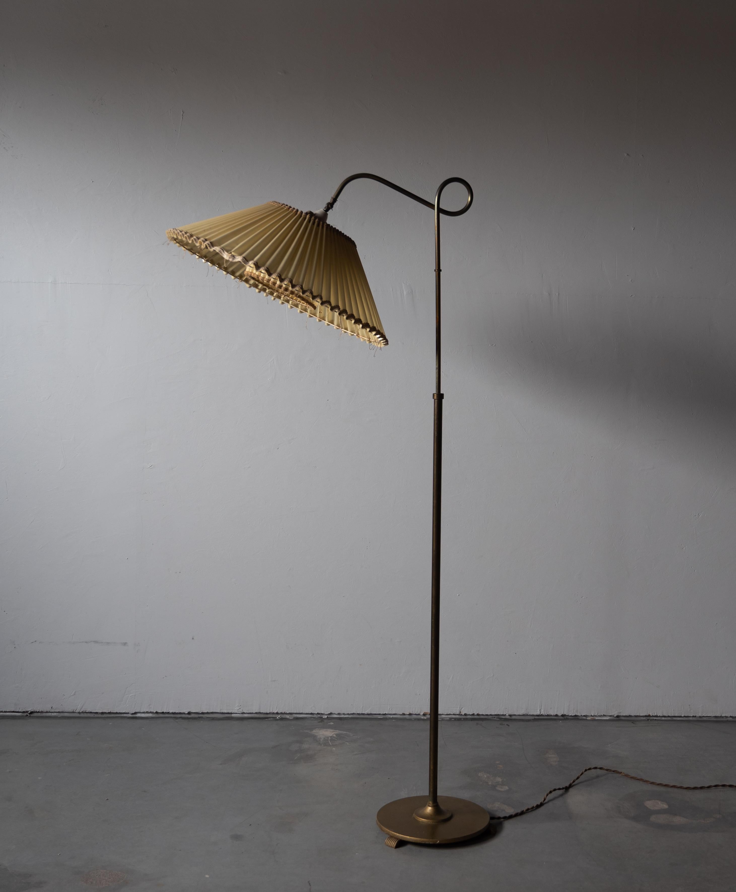 A functionalist floor lamp, designed and produced in Denmark, 1940s. Features brass, metal. Vintage lampshade.

Other designers of the period include Paavo Tynell, Alvar Aalto, J.T. Kalmar, Hans Bergström, and Josef Frank.