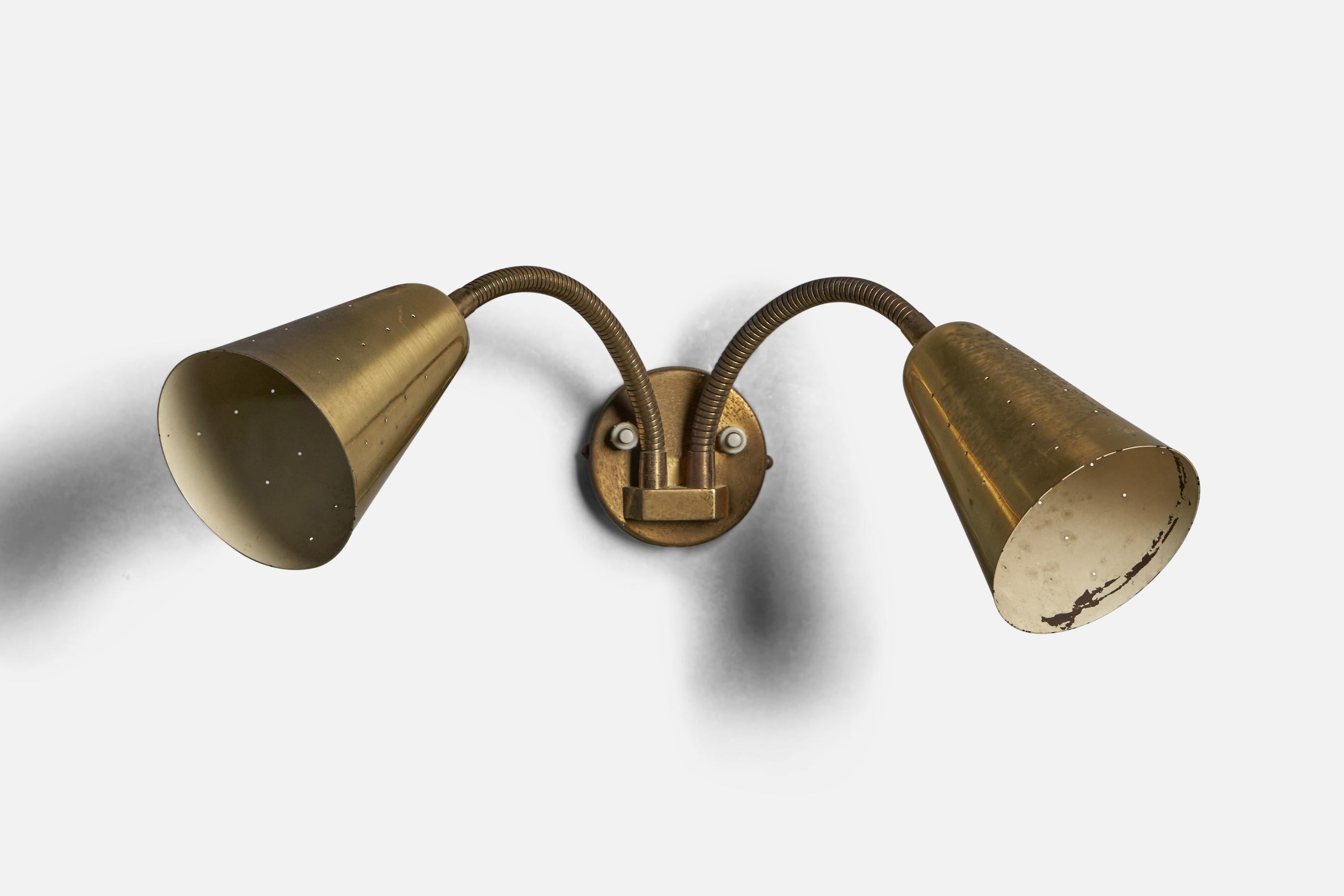 An adjustable two-armed brass wall light, designed and produced in Denmark, 1940s.

Overall Dimensions (inches): 9” H x 19.5” W x 9.5” D
Back Plate Dimensions (inches): 3.25” Diameter x 0.5” D
Bulb Specifications: E-14 Bulb
Number of Sockets: 2
