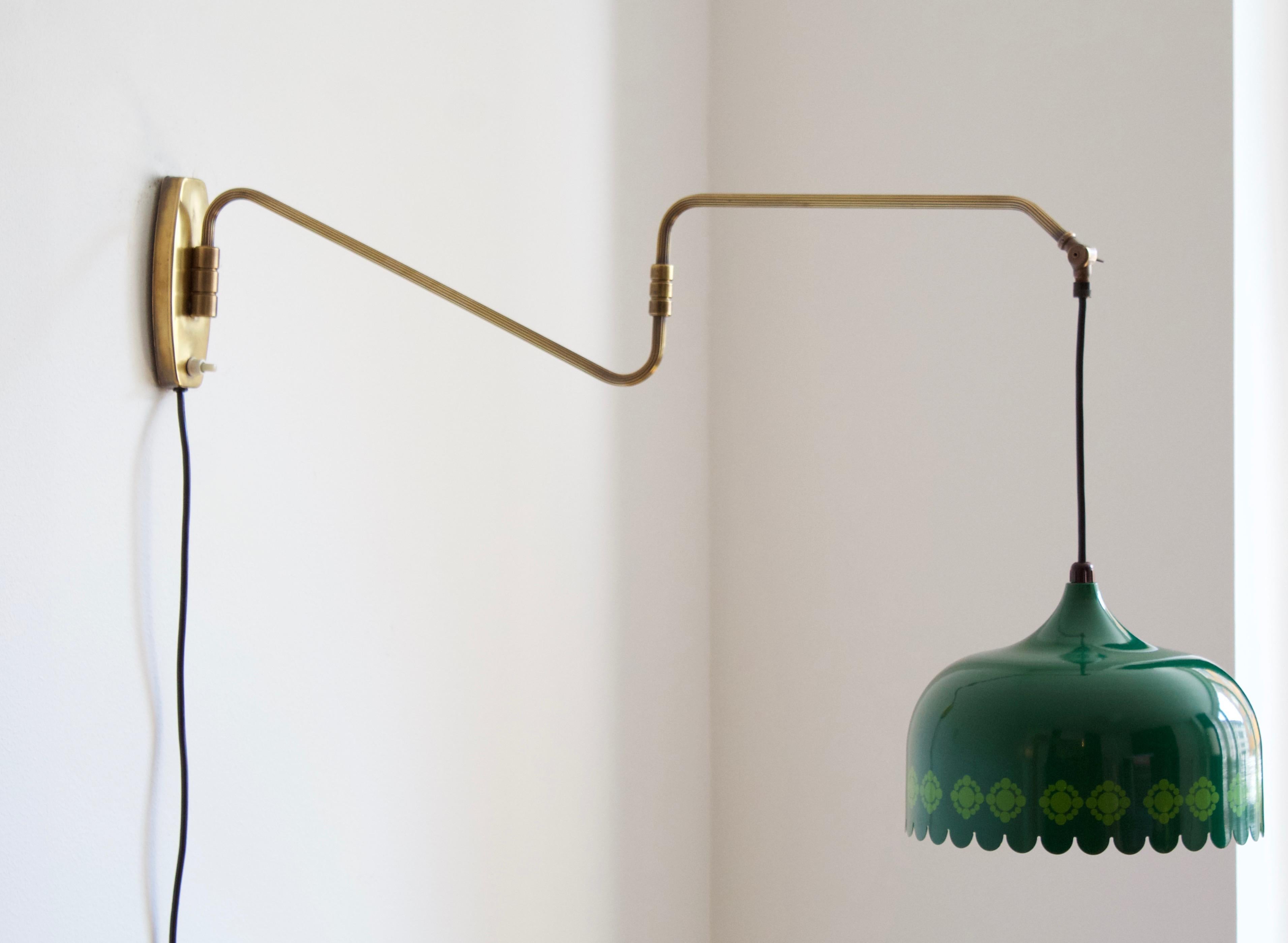 A functionalist wall light / task light, designed and produced in Denmark, 1940s. Features brass. Lacquered metal lampshade.

Stated measurements as is illustrated, dimensions variable.