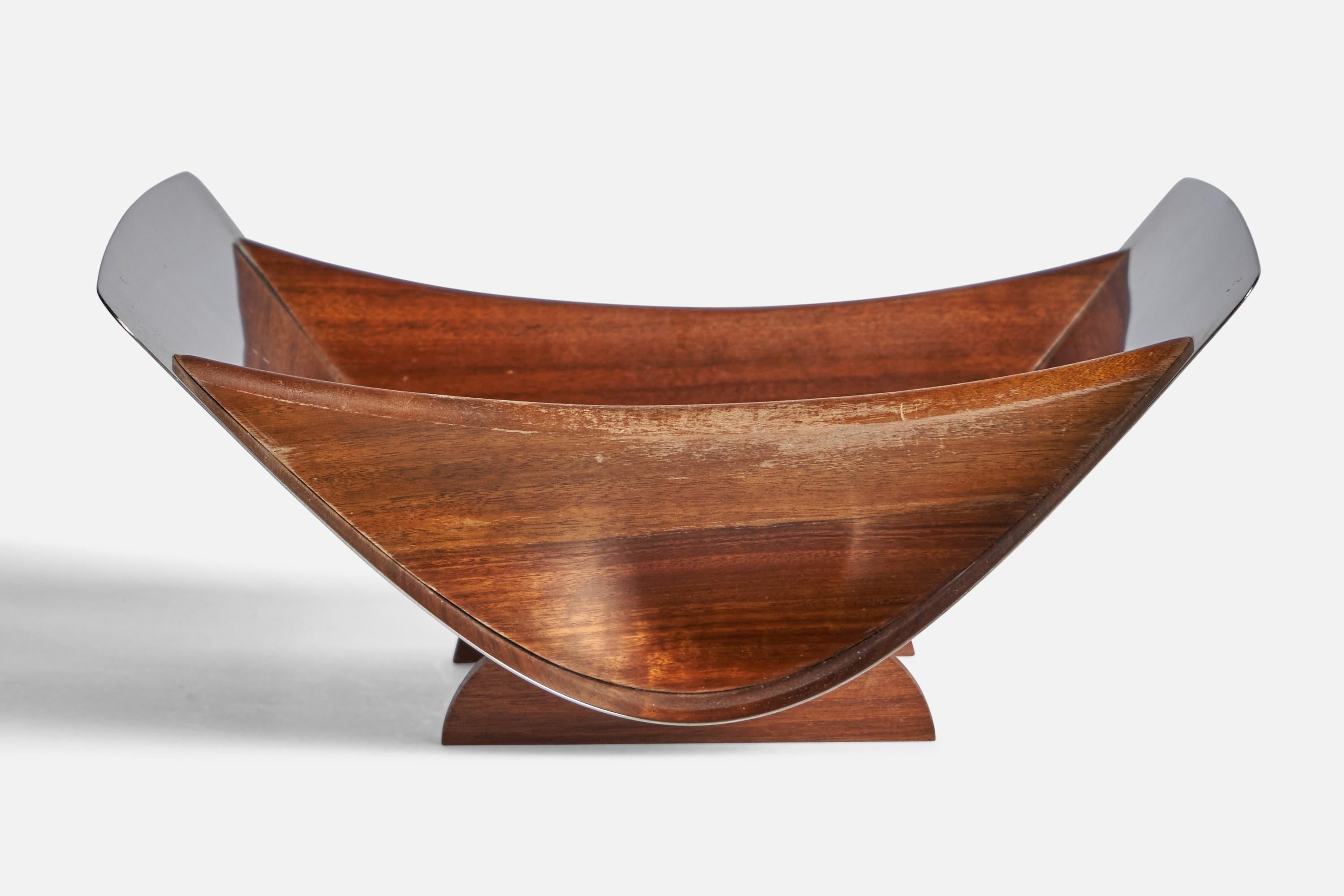 A teak and stainless steel bowl designed and produced in Denmark, 1950s.