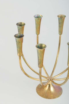 Danish designer. Brass candelabrum with eight curved arms. 1970s
