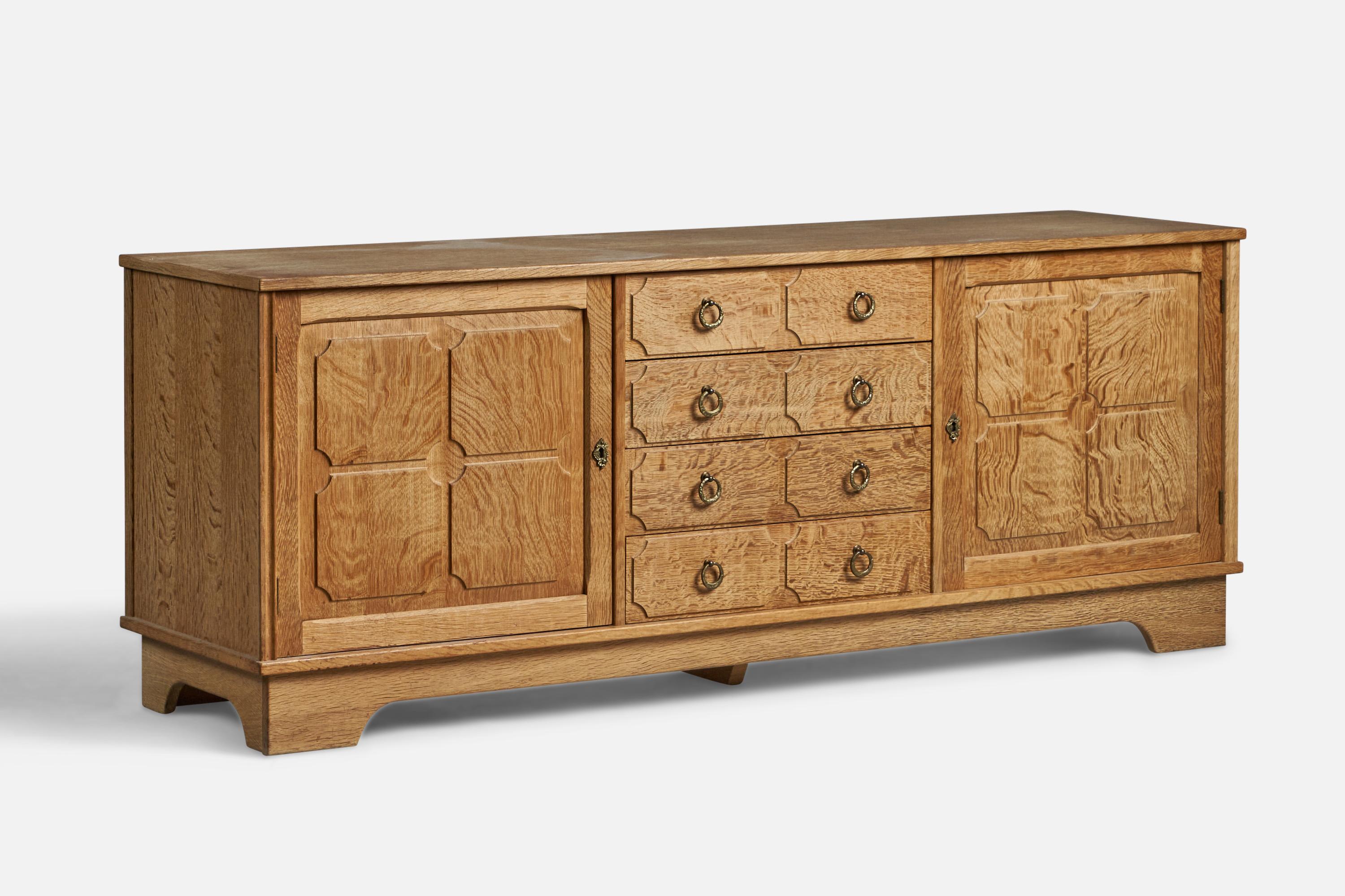 An oak and brass cabinet or sideboard designed and produced in Denmark, 1940s.