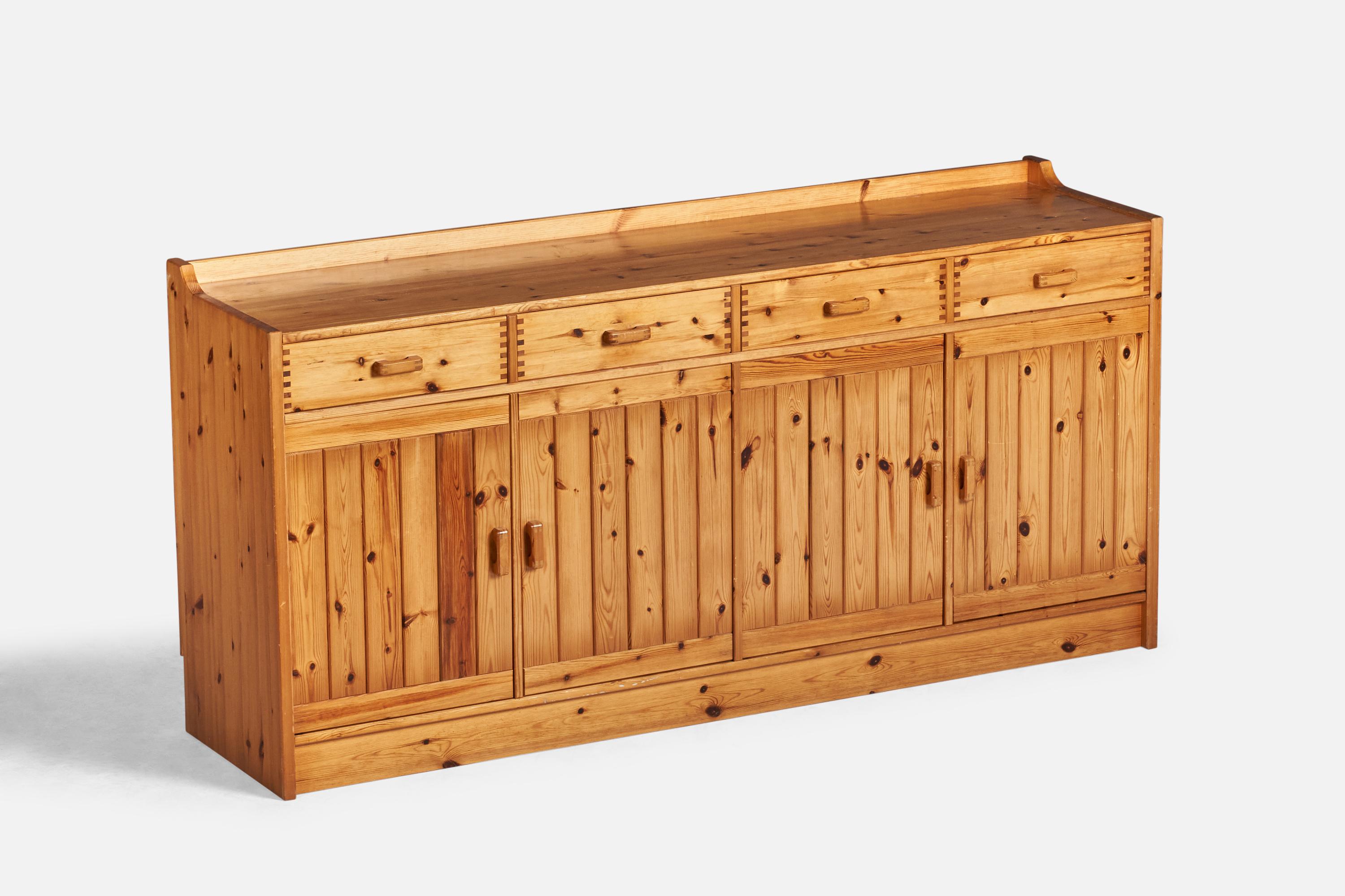 A pine cabinet designed and produced in Denmark, 1970s.