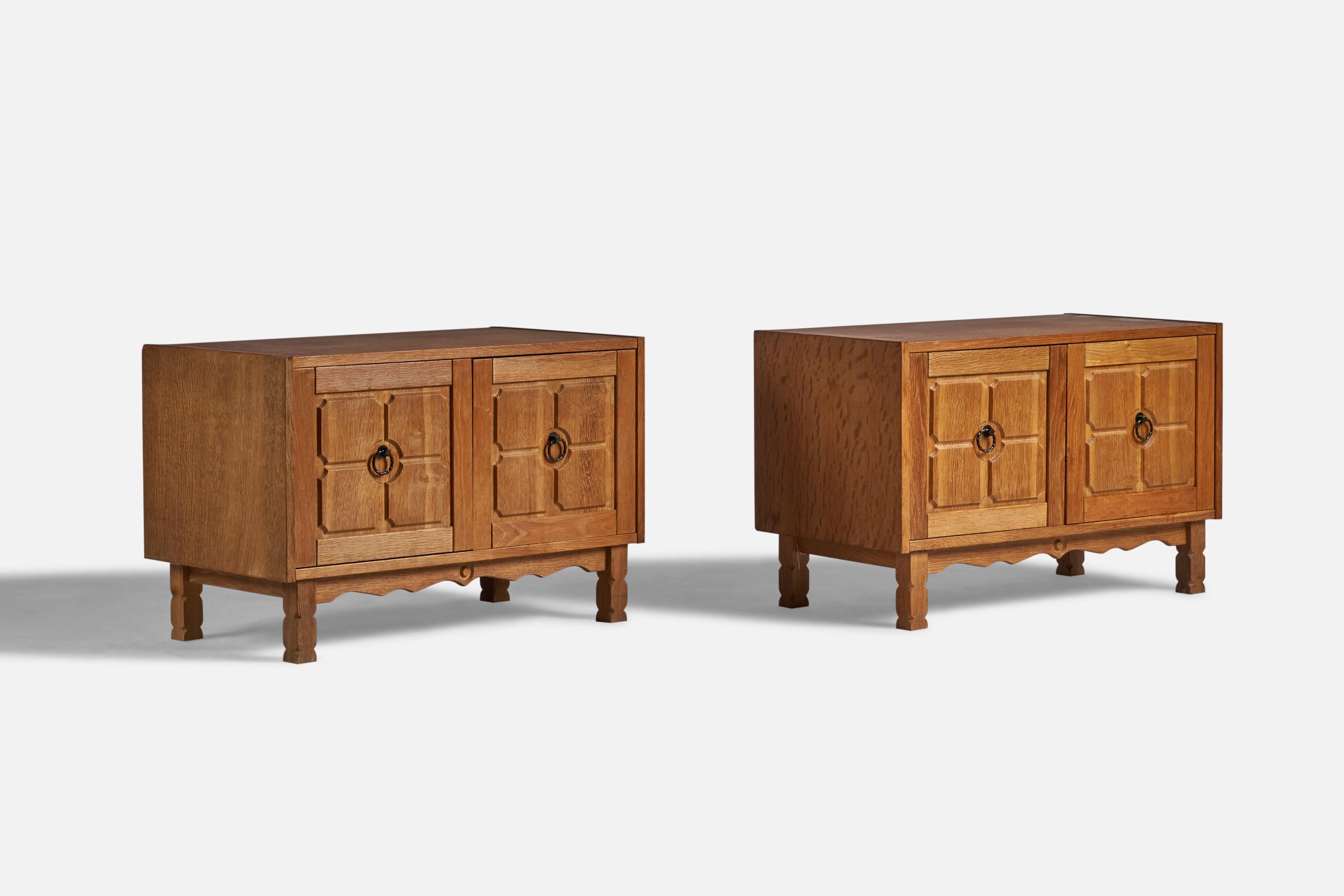 A pair of oak and iron cabinets designed and produced in Denmark, 1960s.
