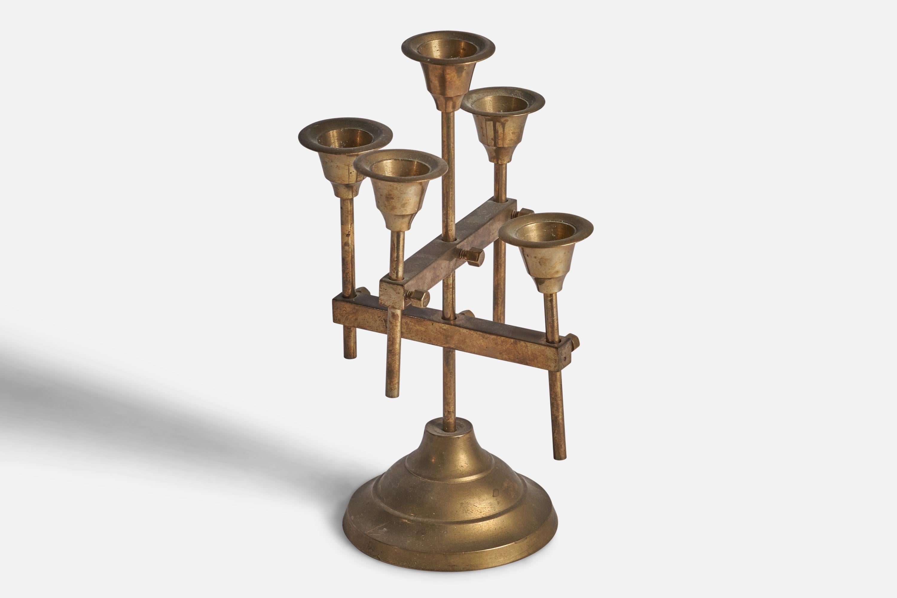 An adjustable brass candelabra designed and produced in Denmark, 1940s.

Fits 0.75”-0.80” diameter candles