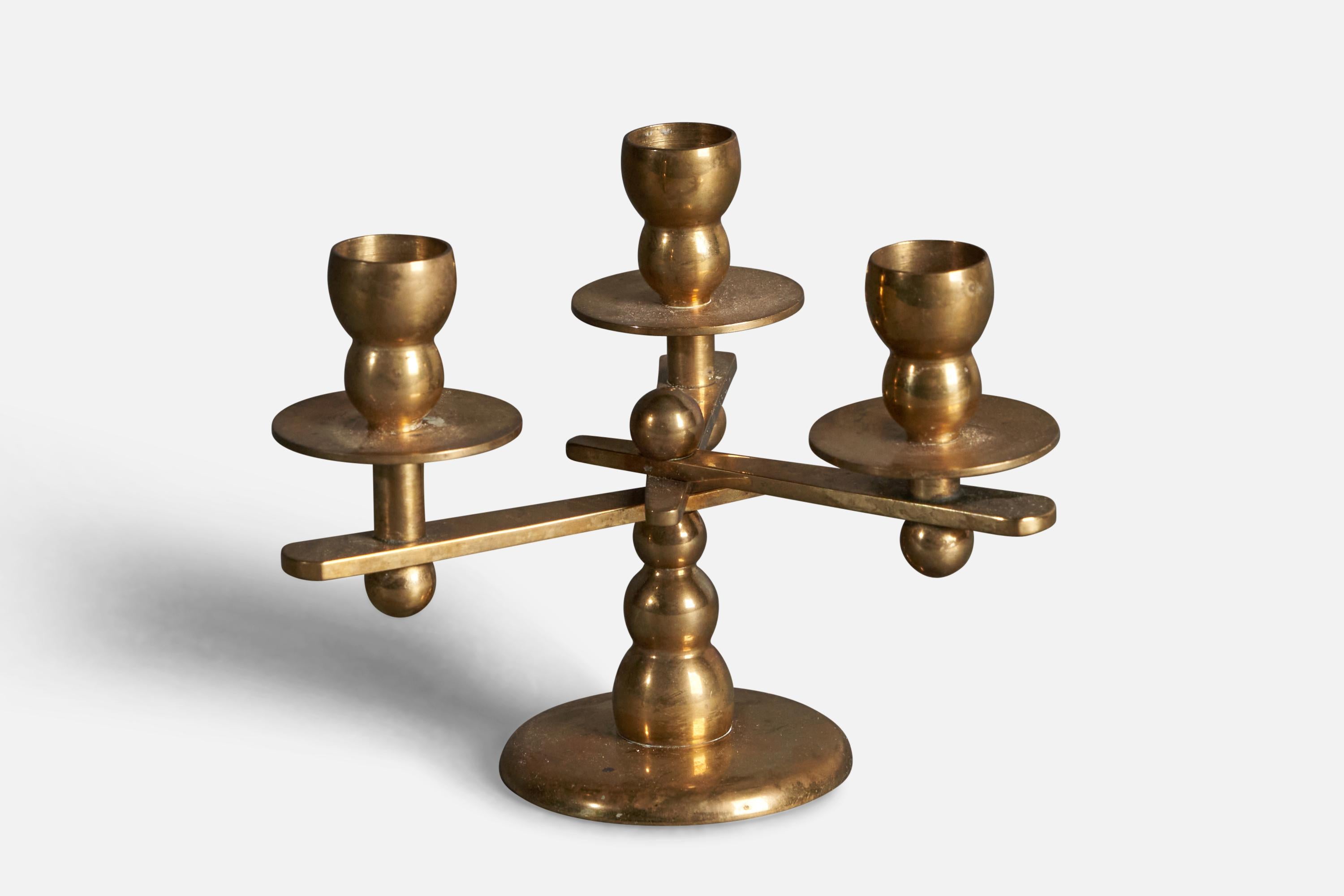 A small brass candelabra designed and produced in Denmark, c. 1960s.