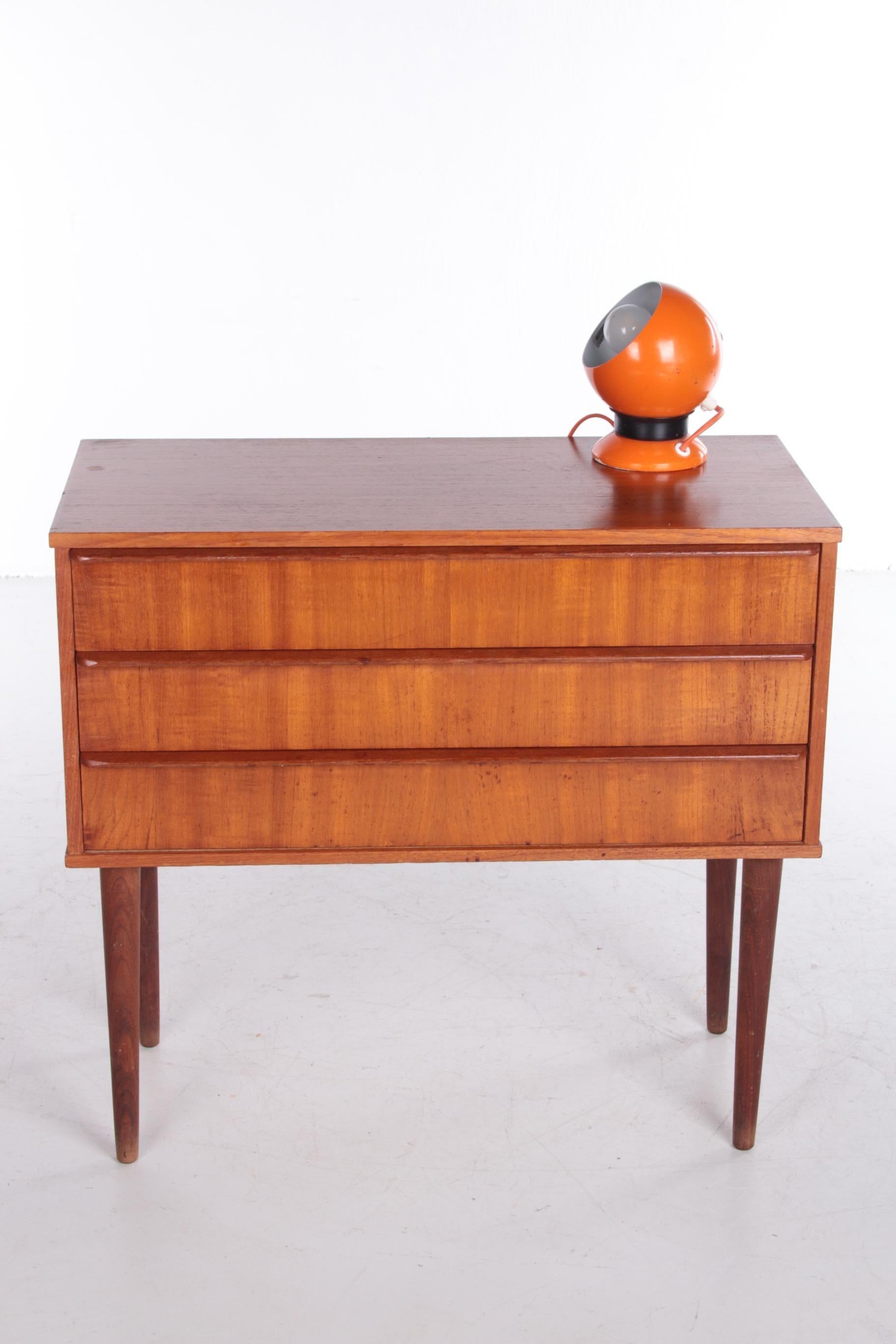 A beautiful designer chest of drawers from Denmark made of teak. The case was probably produced around the 1960s.

This cabinet has three drawers for quick storage of all your belongings. The handles on the drawers have an interesting elongated