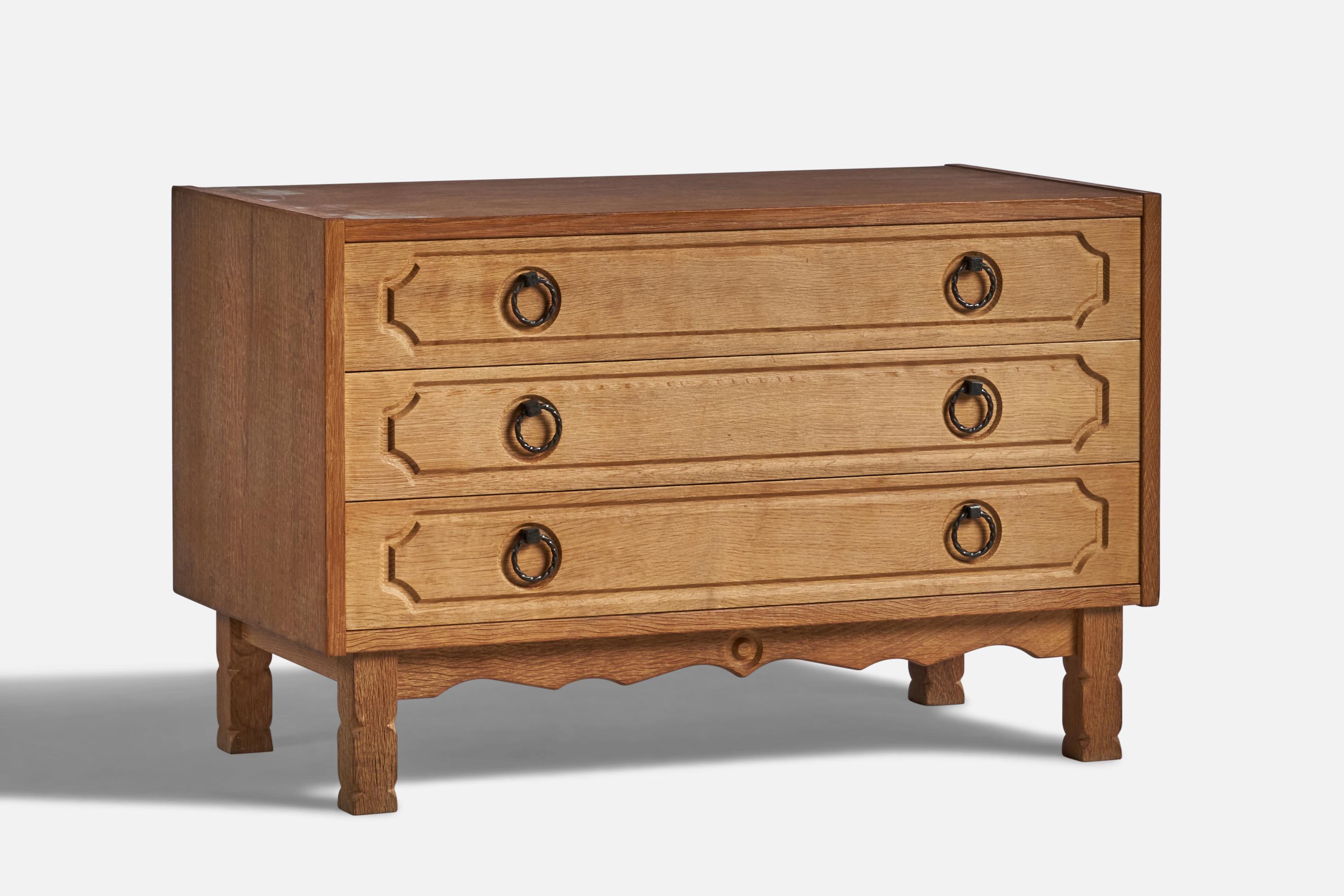 An oak and iron chest of drawers designed and produced in Denmark, 1960s.