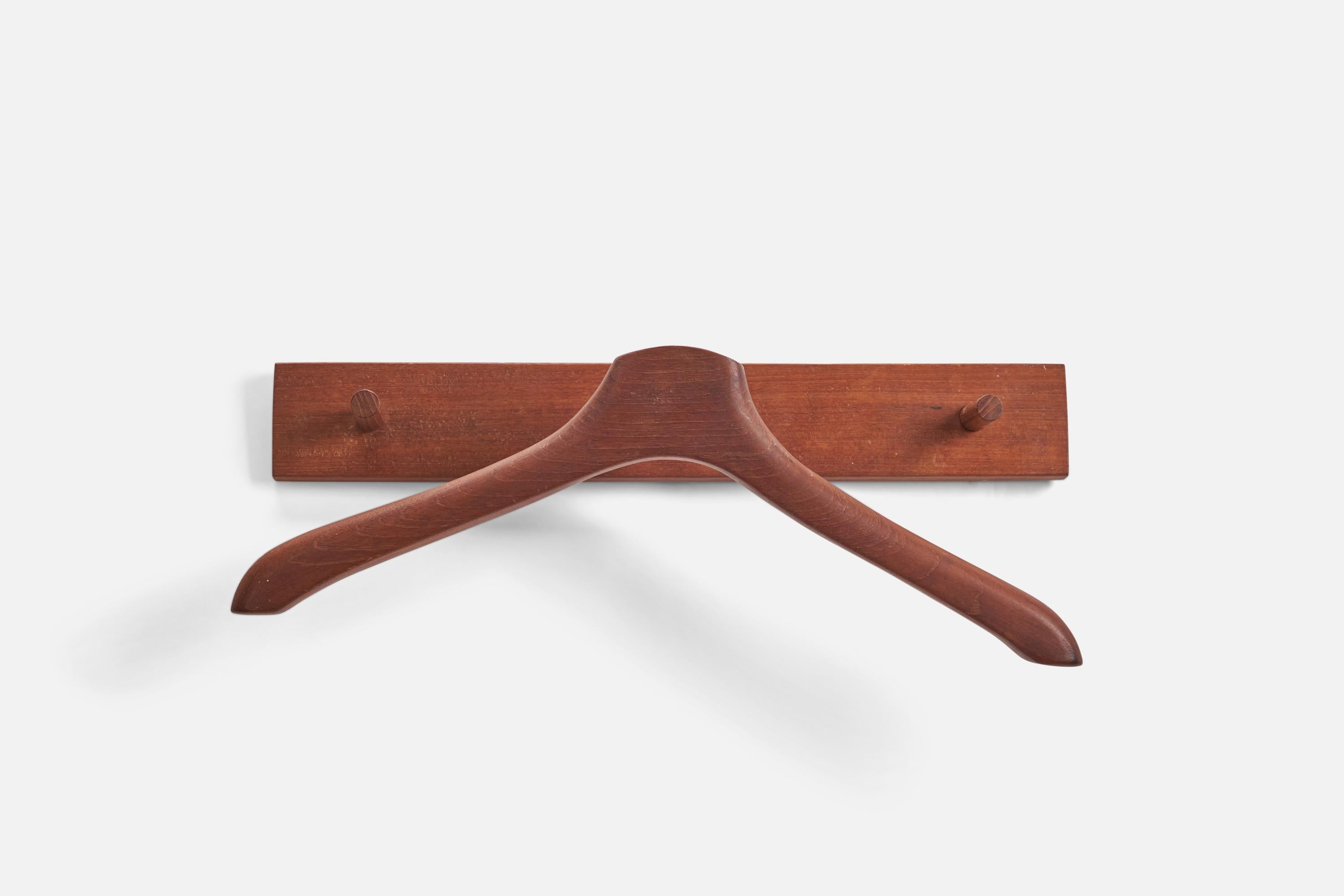 A teak coat rack designed and produced by a Danish Designer, Denmark, 1950s.