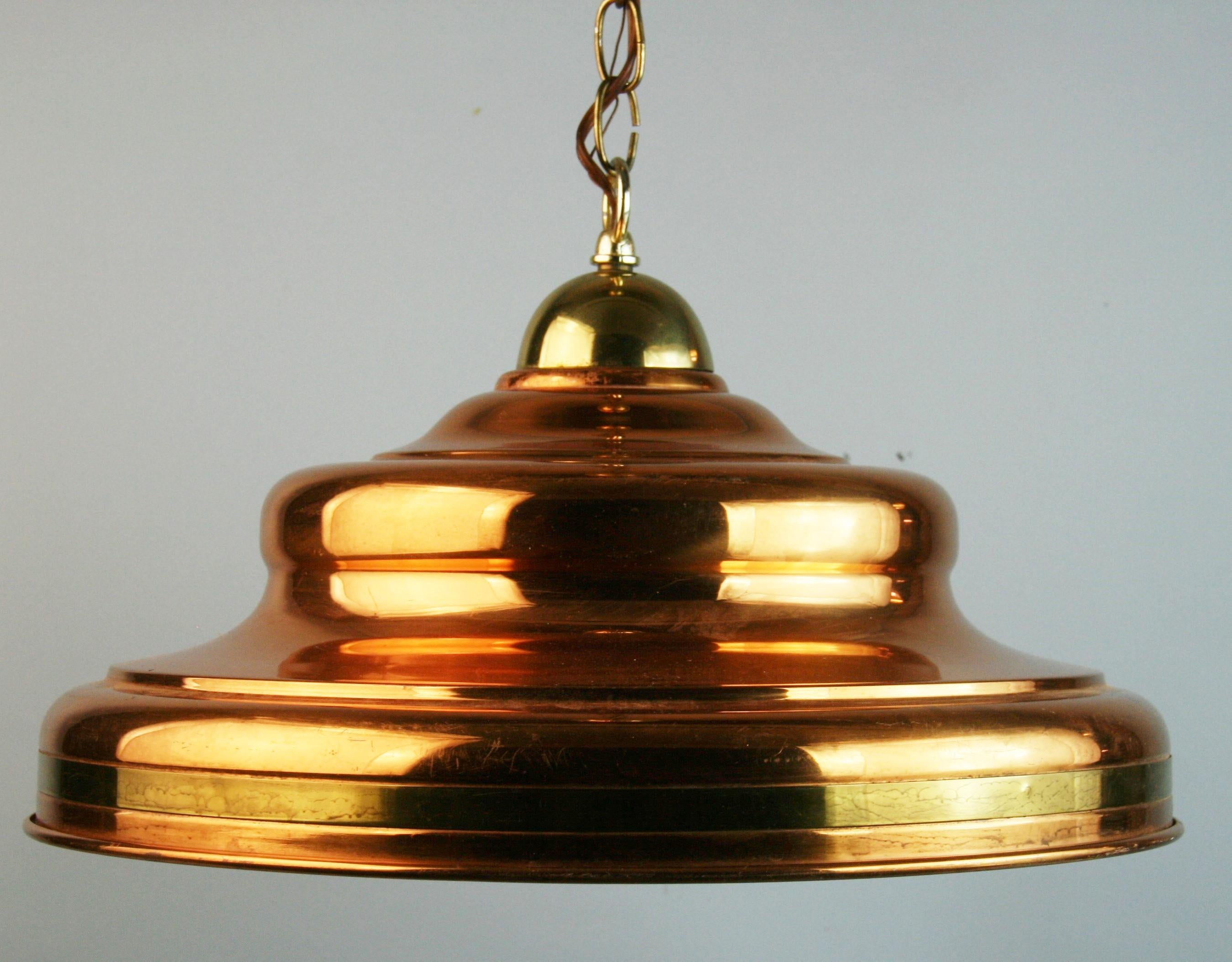 Danish copper and brass pendant with enamel interior
Takes one 100 watt bulb
Supplied with 3 feet chain and canopy.