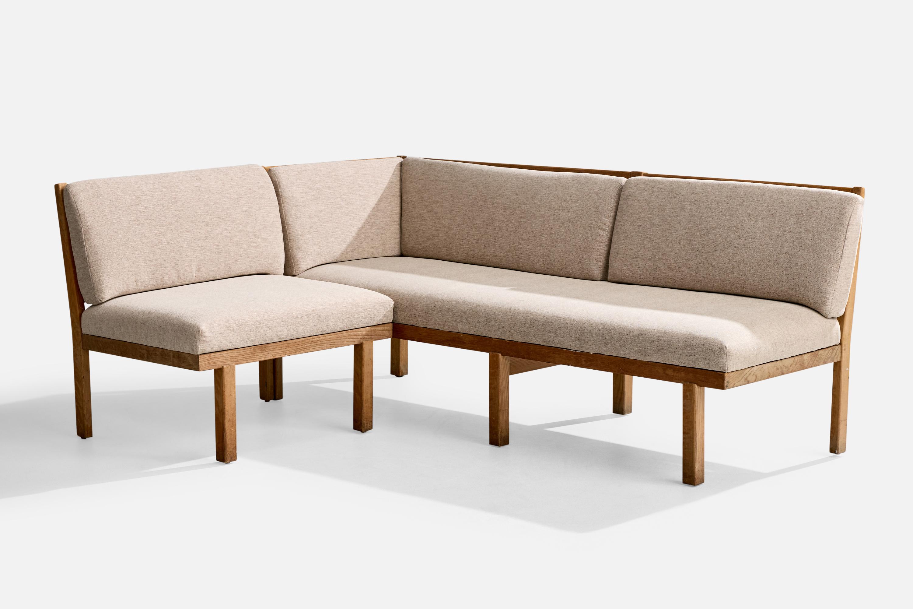An elm and light-grey fabric corner sofa or bench designed and produced by an unknown Danish cabinetmaker, c. 1940s.

Light discoloration present throughout wooden frame. 

Reupholstered in brand new fabric.

Overall Dimensions (inches): 29.75