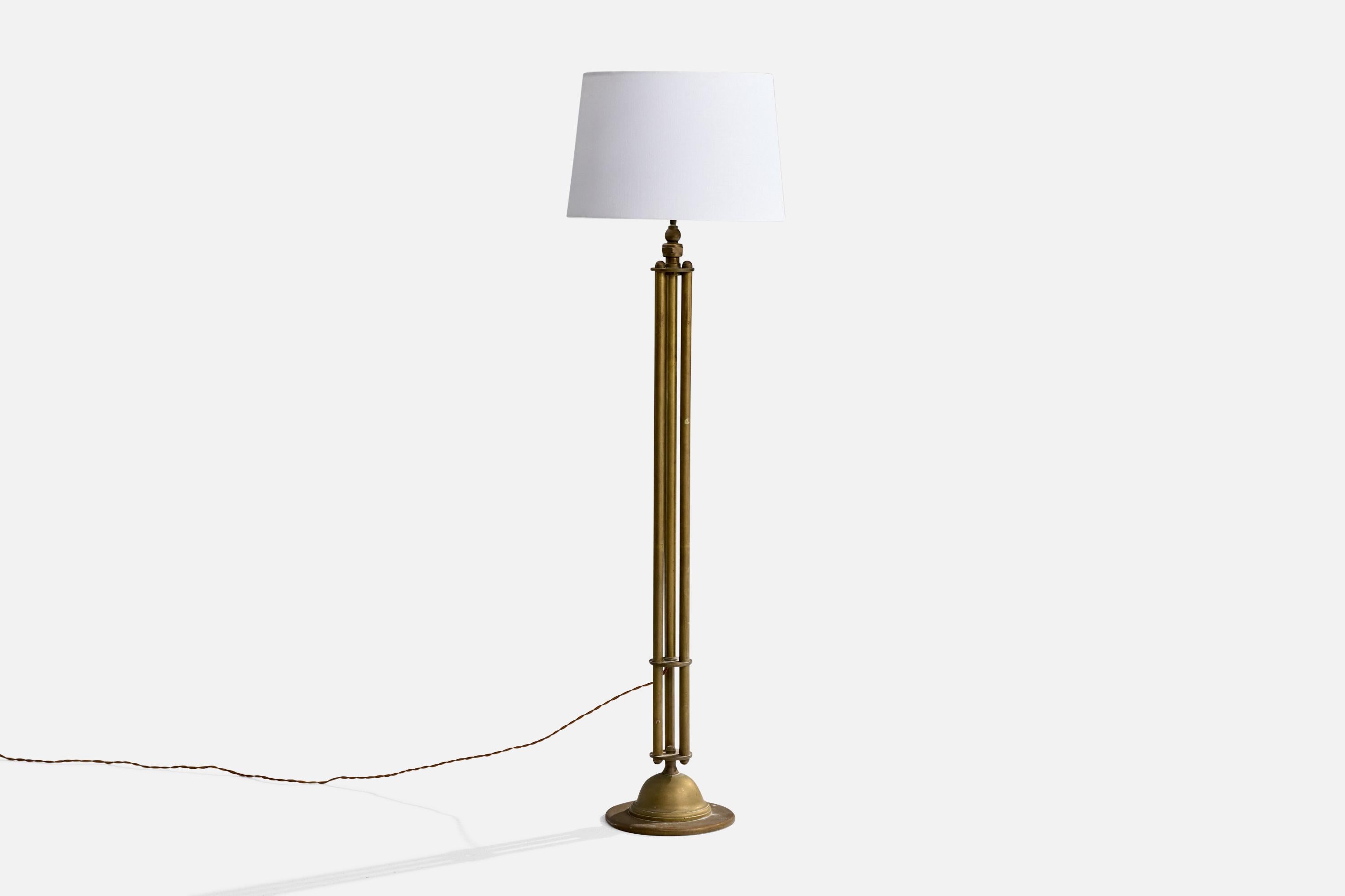 A brass and white fabric floor lamp designed and produced in Denmark, c. 1920s.

Overall Dimensions (inches): 52.5