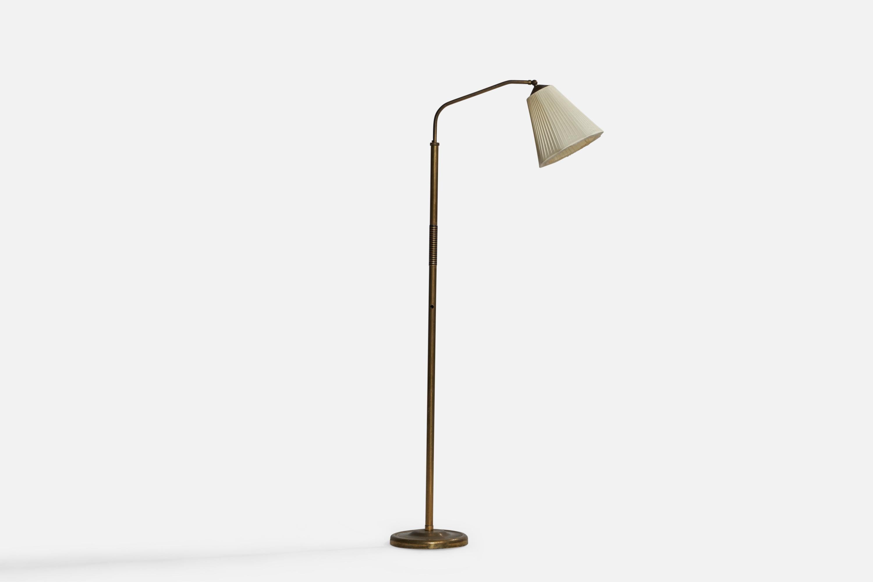 An adjustable brass and off-white fabric floor lamp designed and produced in Denmark, 1940s.

Overall Dimensions (inches): 57.25” H x 9.75” W x 25.25” D. Stated dimensions include shade.
Dimensions vary based on position of light.
Bulb