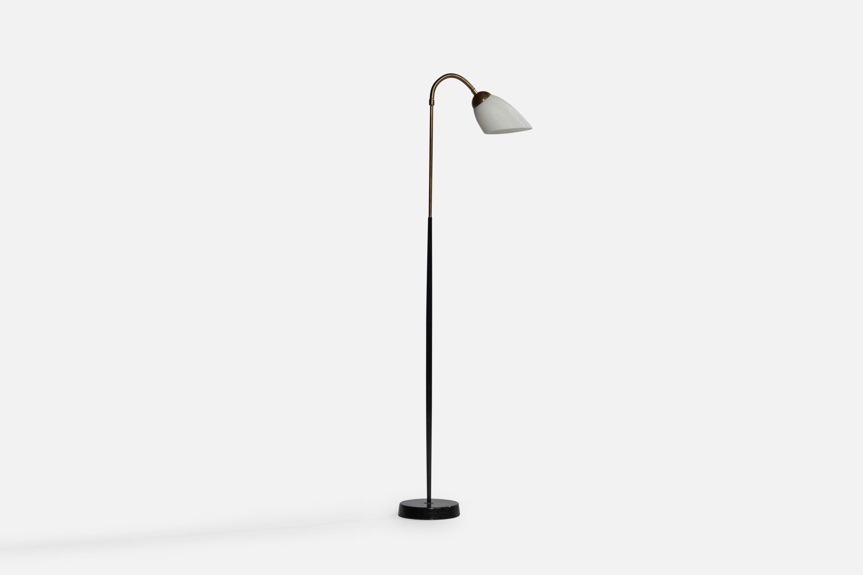 An adjustable brass, black-lacquered metal and opaline glass floor lamp designed and produced in Denmark, 1940s.

Overall Dimensions (inches): 49.9” H x 7” W x 17.4” D. Stated dimensions include glass shade.
Dimensions vary based on position of