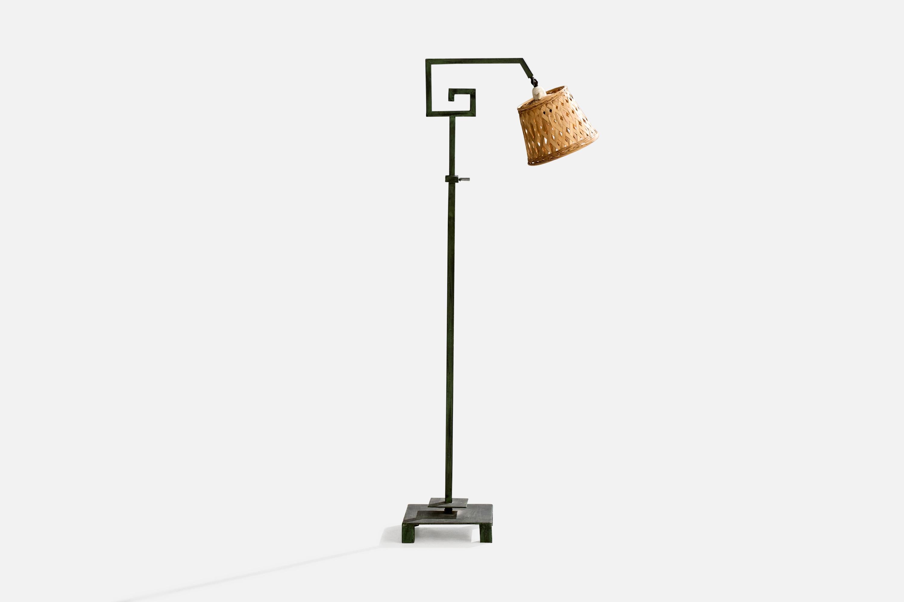 An adjustable green-painted iron and rattan floor lamp designed and produced in Denmark, c. 1940s.

Dimensions of Lamp with Shade (inches): 49.3