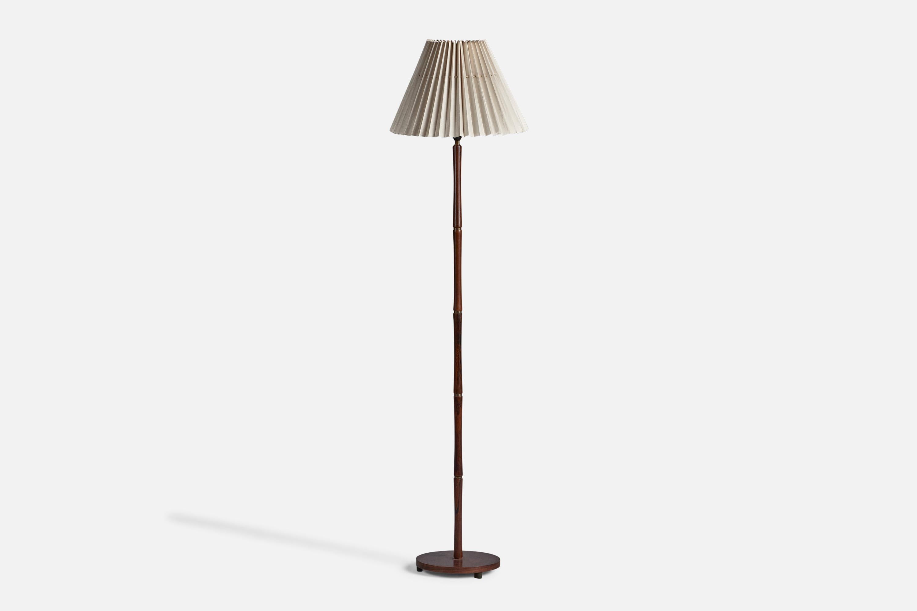 A rosewood and fabric floor lamp, designed and produced in Denmark, 1950s.

Overall Dimensions (inches): 64.5