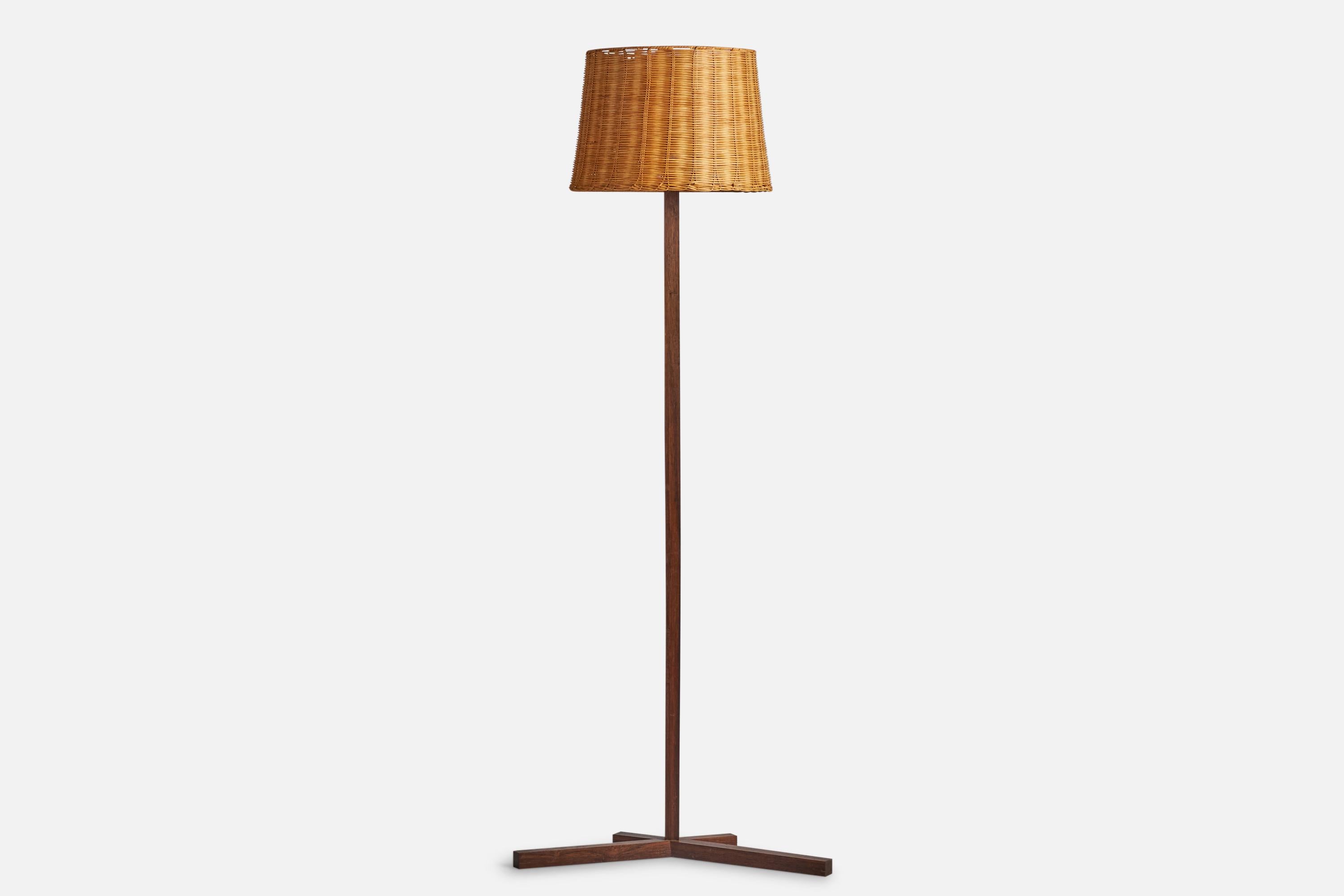 A rosewood and rattan floor lamp designed and produced in Denmark, c. 1950s.

Overall Dimensions (inches): 66” H x 25.75” W x 17” D
Bulb Specifications: E-26 Bulb
Number of Sockets: 1
All lighting will be converted for US usage. We are unable to