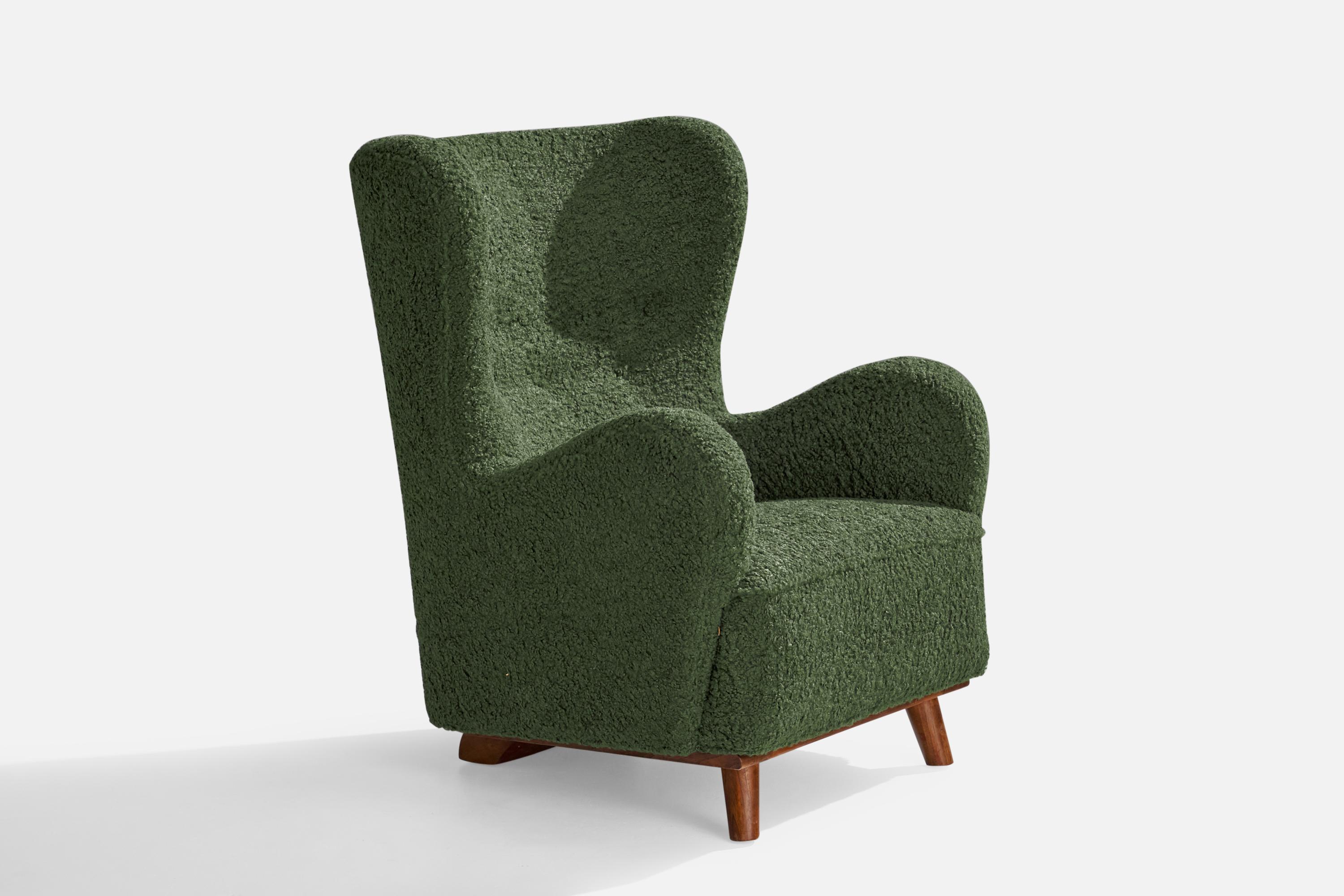 A green bouclé fabric and stained beech lounge chair designed and produced in Denmark, c. 1930s.

Seat height 16.5”.