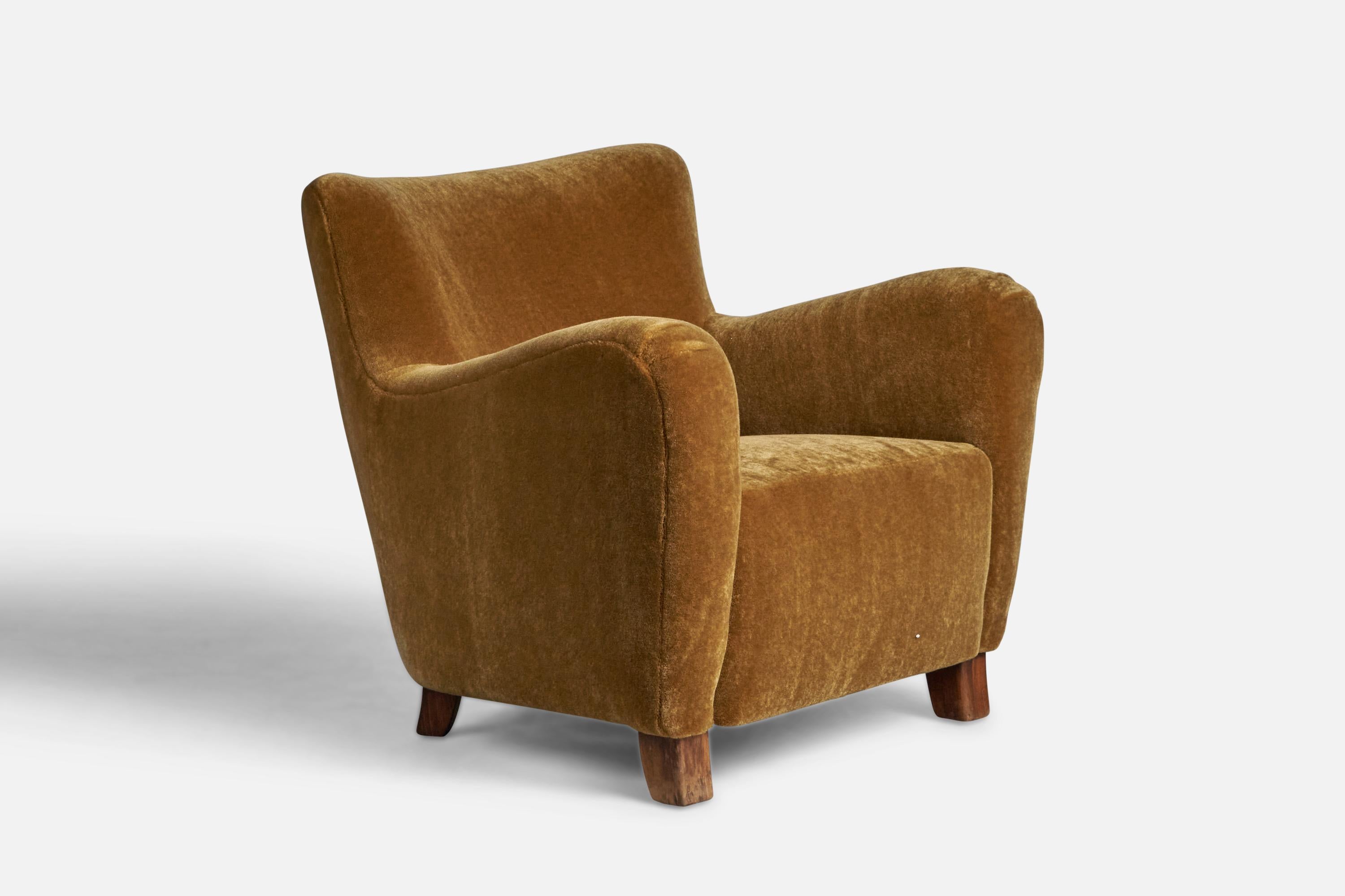 A stained wood and orange beige mohair lounge chair designed and produced in Denmark, 1940s.

16” seat height