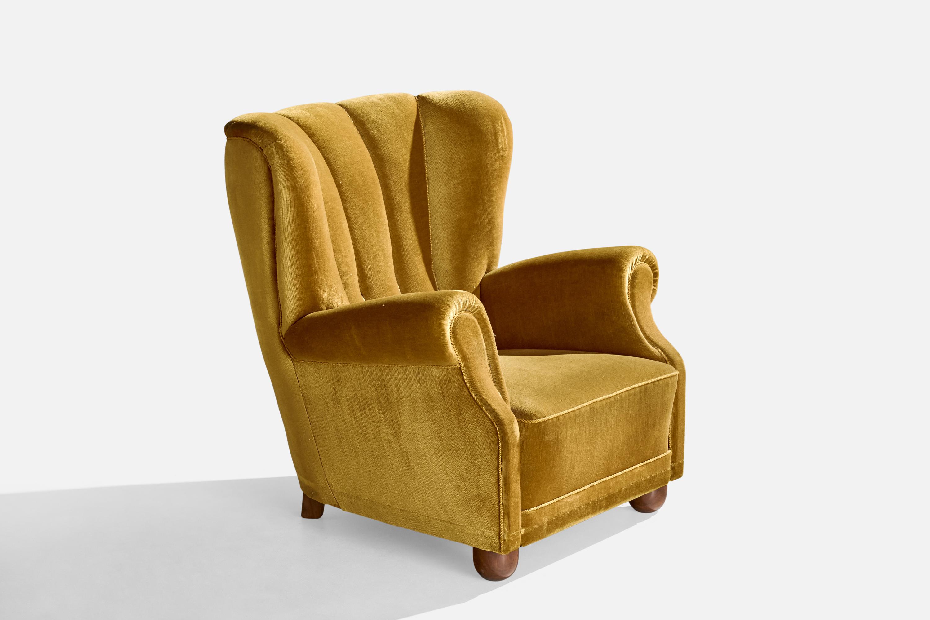 A wood and yellow velvet lounge chair designed and produced in Denmark, c. 1940s.

Seat height: 14